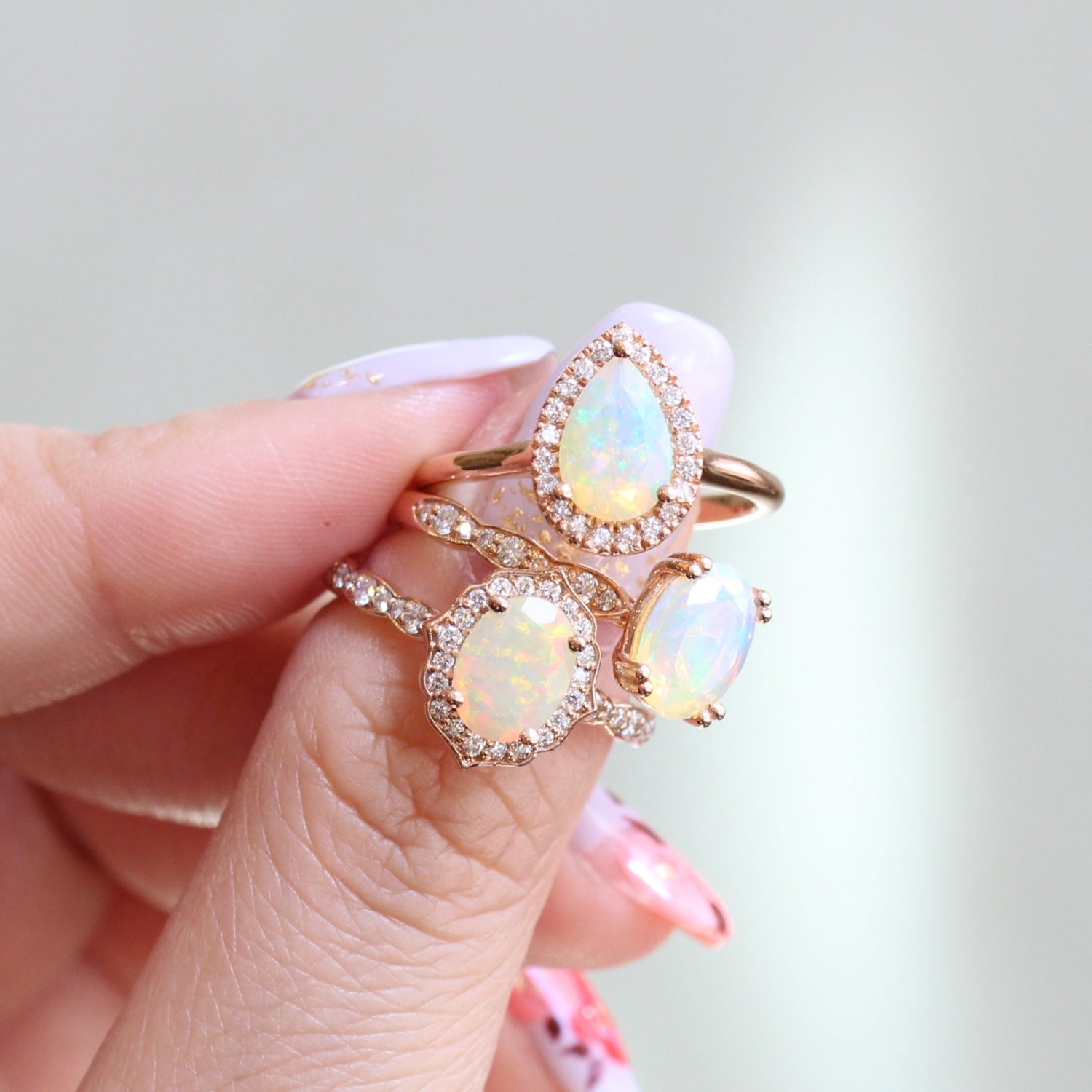 opal engagement rings in rose gold with diamond wedding band set by La More Design Jewelry