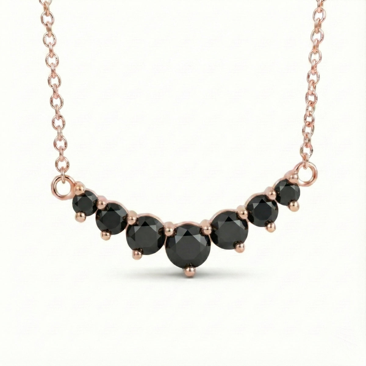 14k rose gold black diamond necklace in a curved 7 stone setting pendant with natural black diamonds la more design jewelry