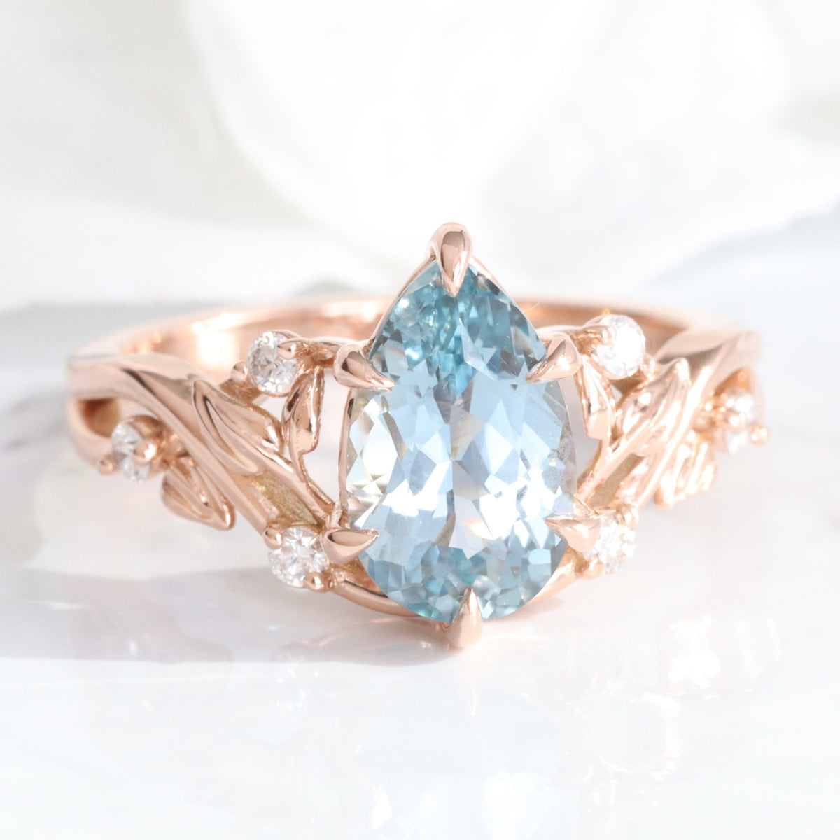 Pear aqua blue sapphire ring rose gold floral leaf diamond sapphire solitaire ring la more design jewelry