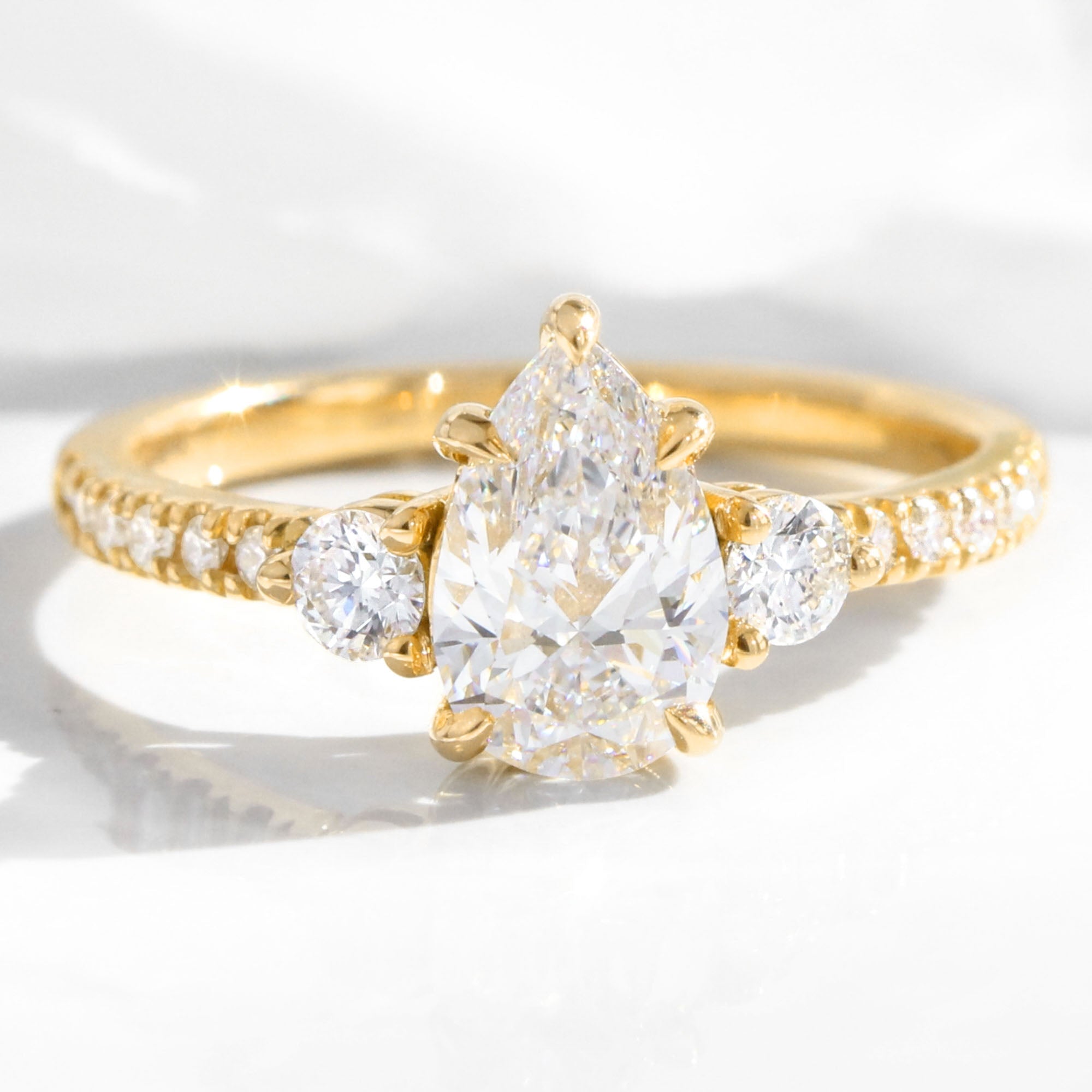 Pear lab diamond 3 stone engagement ring yellow gold cluster pave ring la more design jewelry