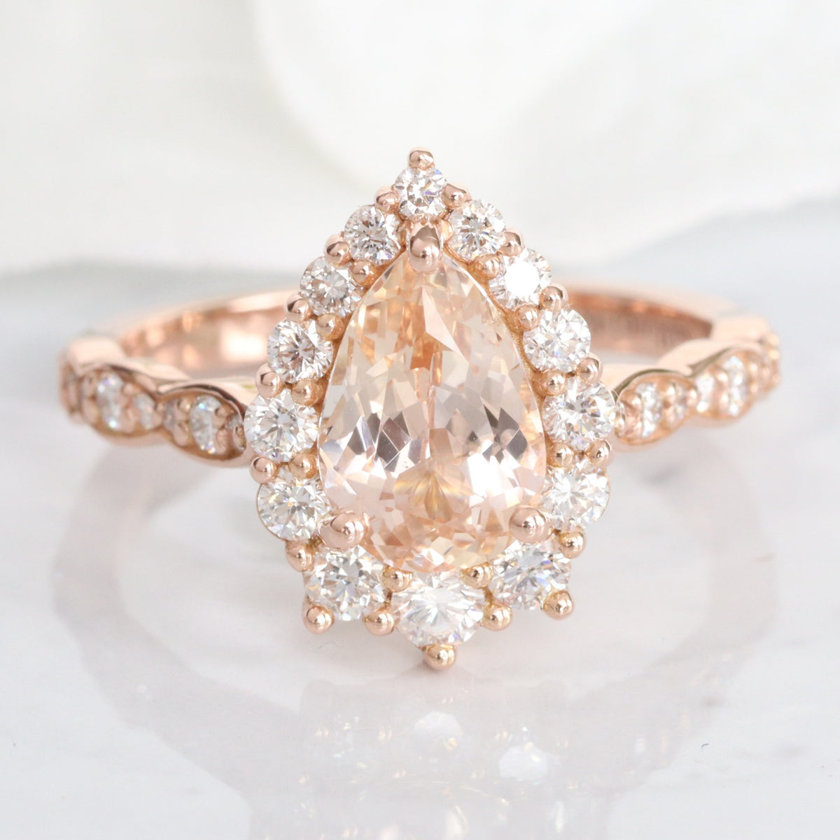 Pear peach sapphire engagement ring rose gold halo diamond pink sapphire ring la more design jewelry
