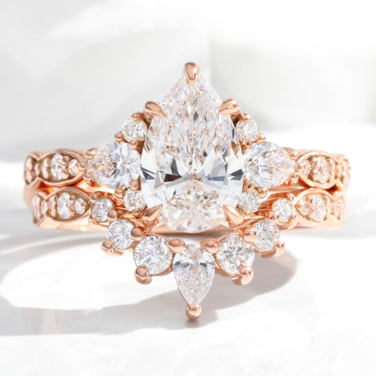 large pear lab grown diamond 3 stone ring bridal set rose gold curved diamond ring stack la more design jewelry