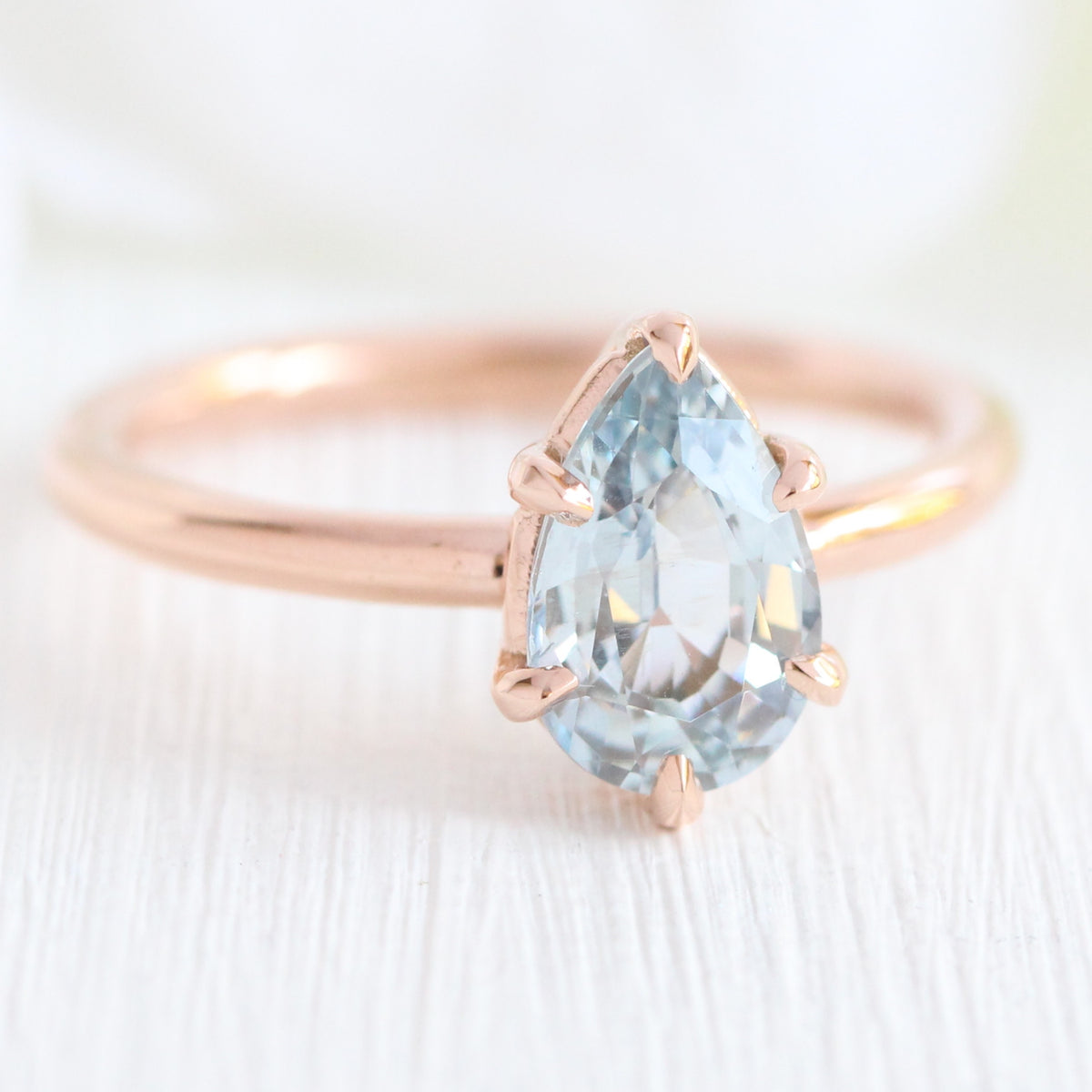 Pear aqua blue sapphire engagement ring rose gold low profile solitaire ring la more design jewelry