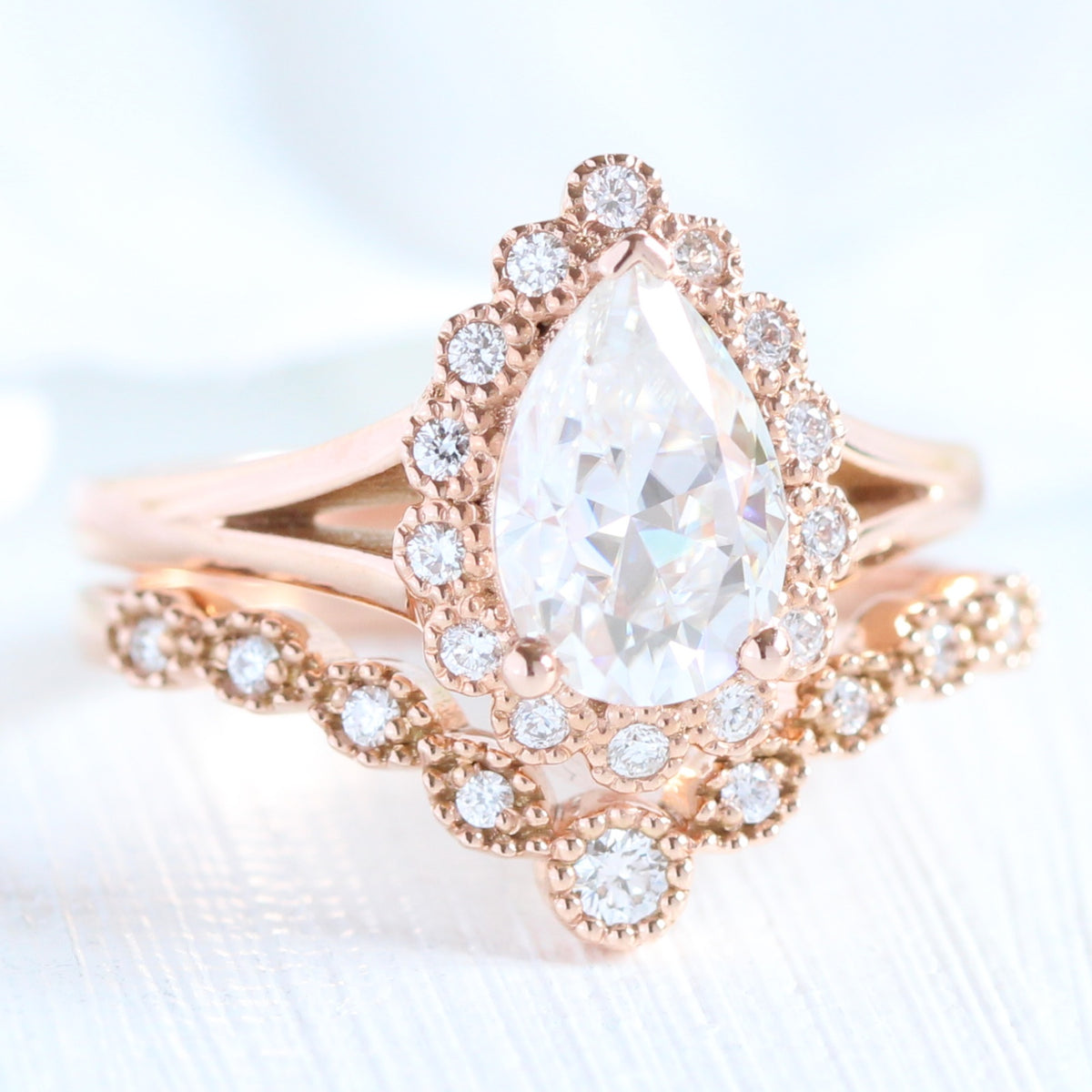 Pear moissanite ring bridal set in rose gold vintage inspired diamond band by la more design jewelry