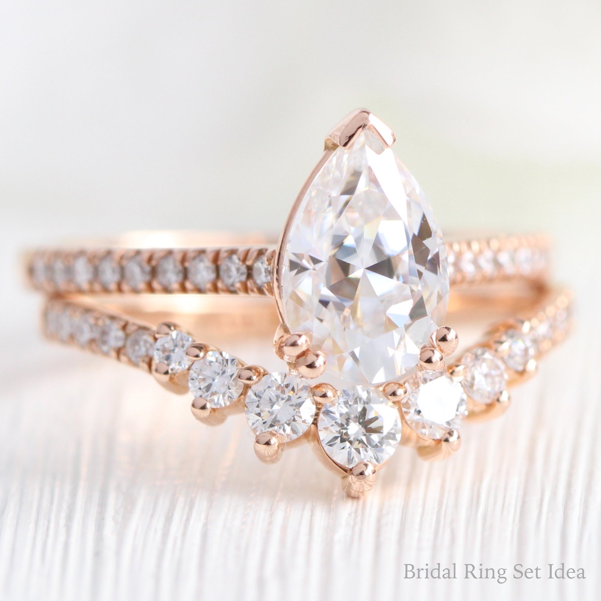 Pear moissanite solitaire ring rose gold curved diamond wedding ring set la more design jewelry