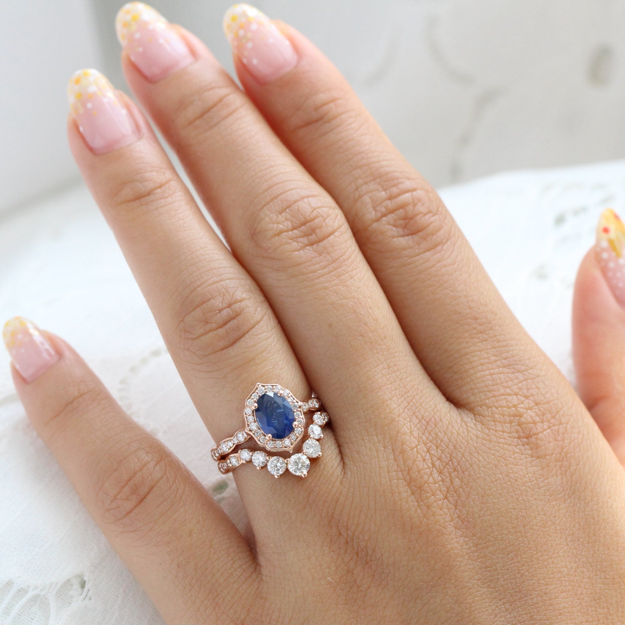 Oval sapphire ring with diamond halo hot sale
