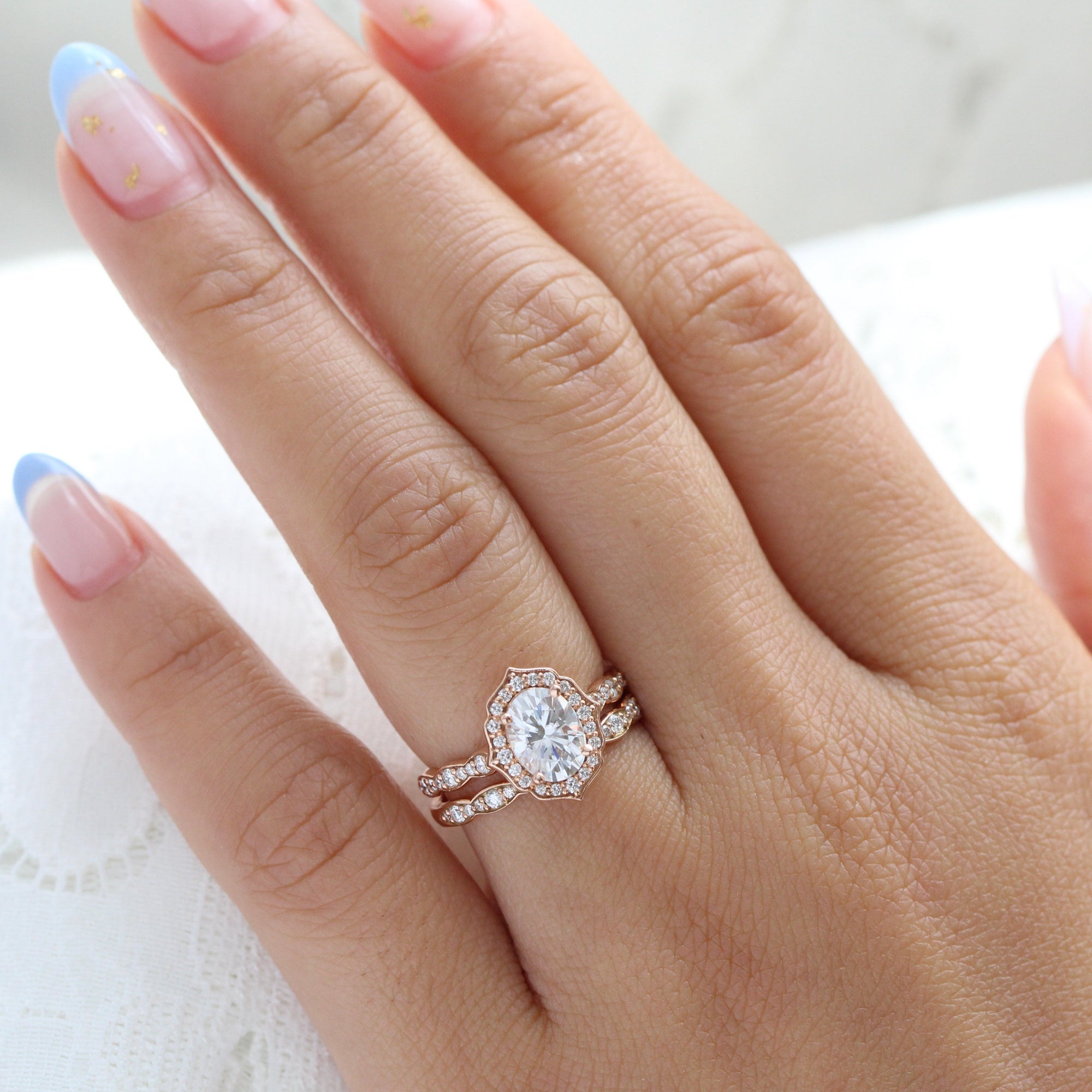 Oval Moissanite Bridal Ring Set in Rose Gold Floral Diamond Band La More Design