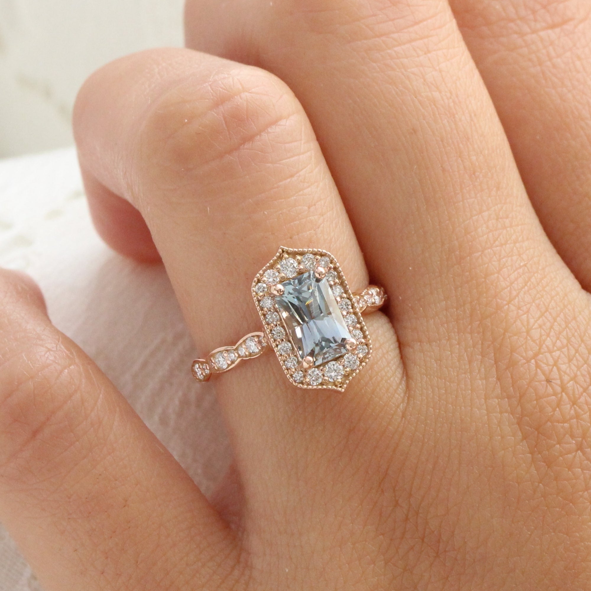 Rose gold emerald cut ring top