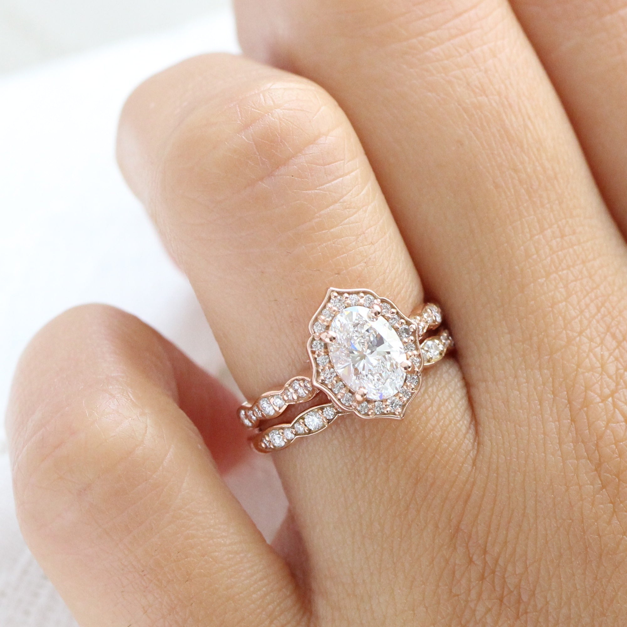 Oval floral halo engagement ring discount