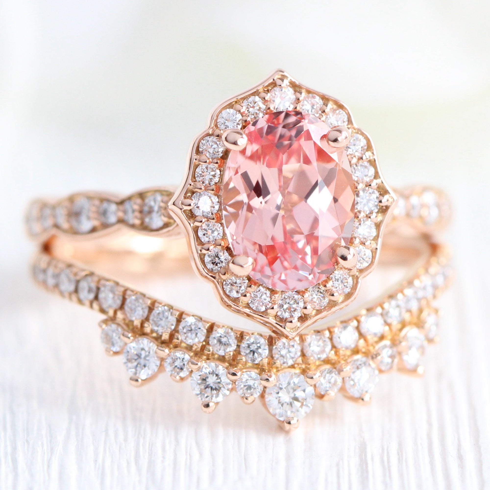 peach sapphire ring and curved crown diamond band in rose gold bridal set by la more design