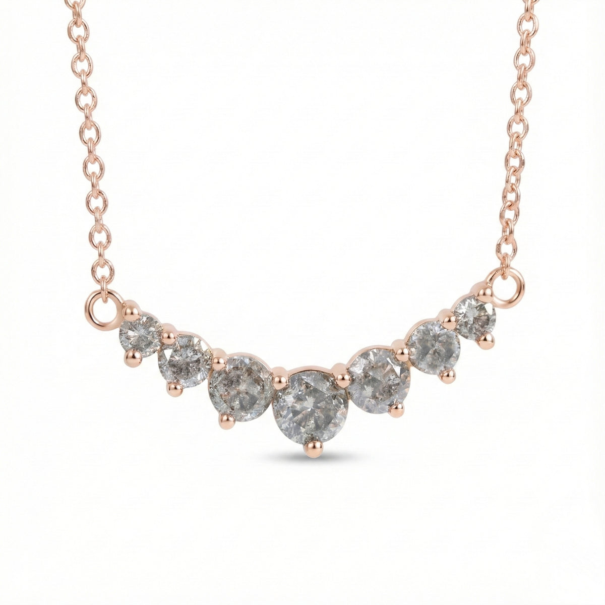 14k rose gold salt and pepper diamond necklace in a curved 7 stone setting pendant with natural grey diamonds la more design jewelry