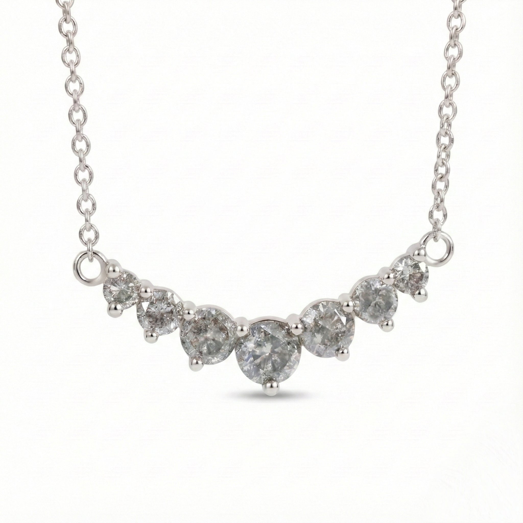 14k white gold salt and pepper diamond necklace in a curved 7 stone setting pendant with natural grey diamonds la more design jewelry