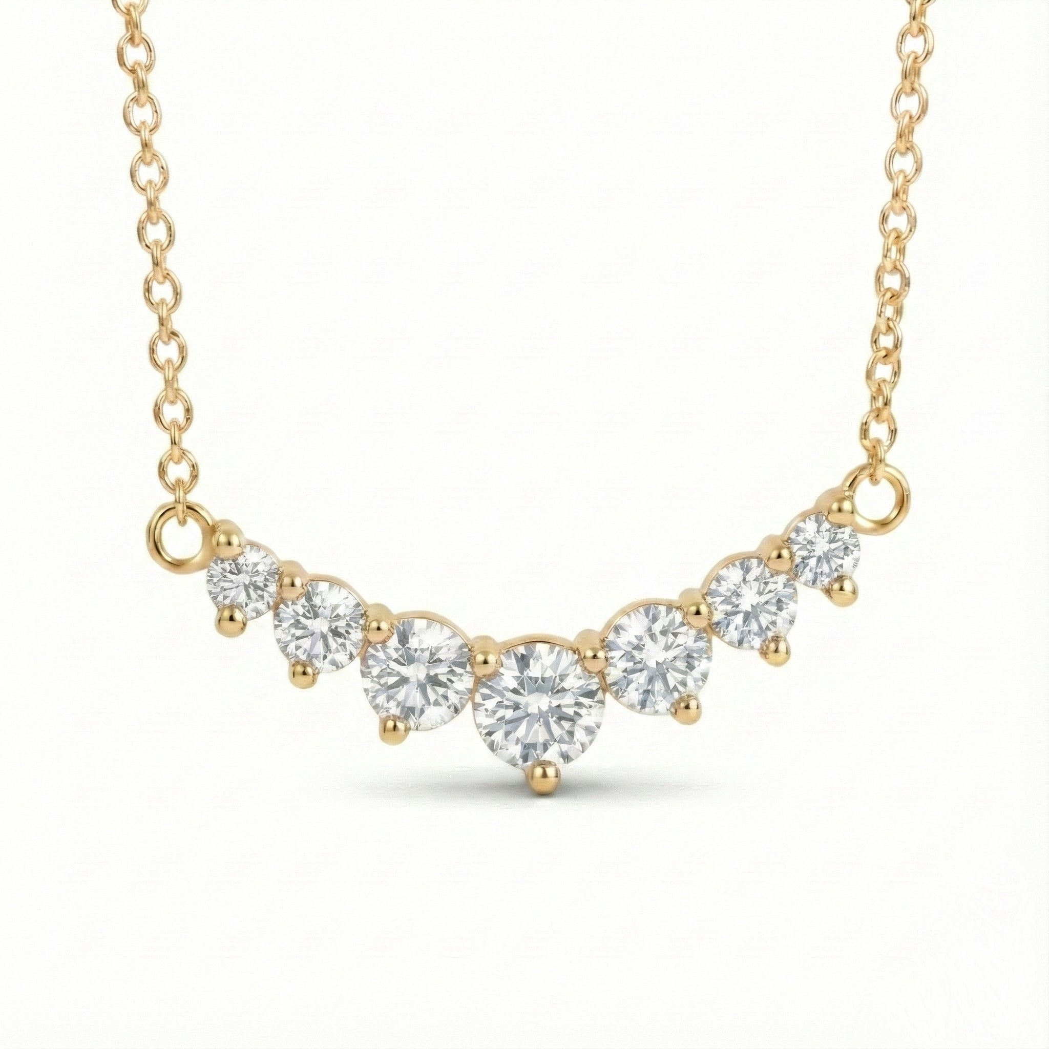 14k yellow gold diamond arc necklace with 7 graduated round diamonds in a curved smile setting pendant la more design jewelry