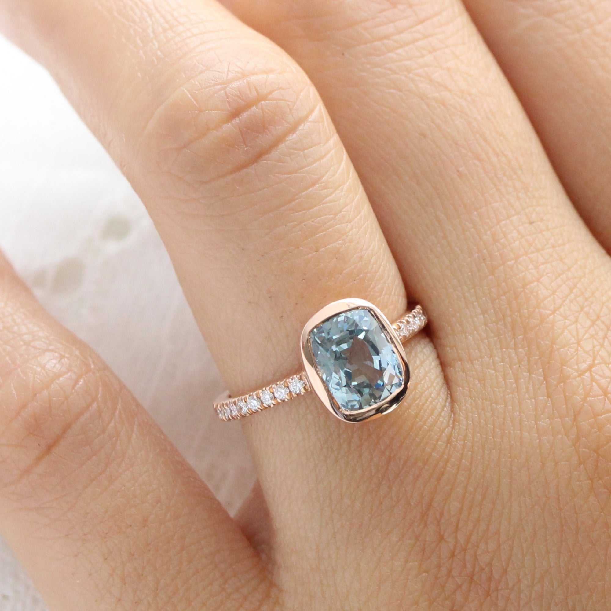 Cushion aqua blue sapphire ring rose gold bezel solitaire pave diamond band la more design jewelry