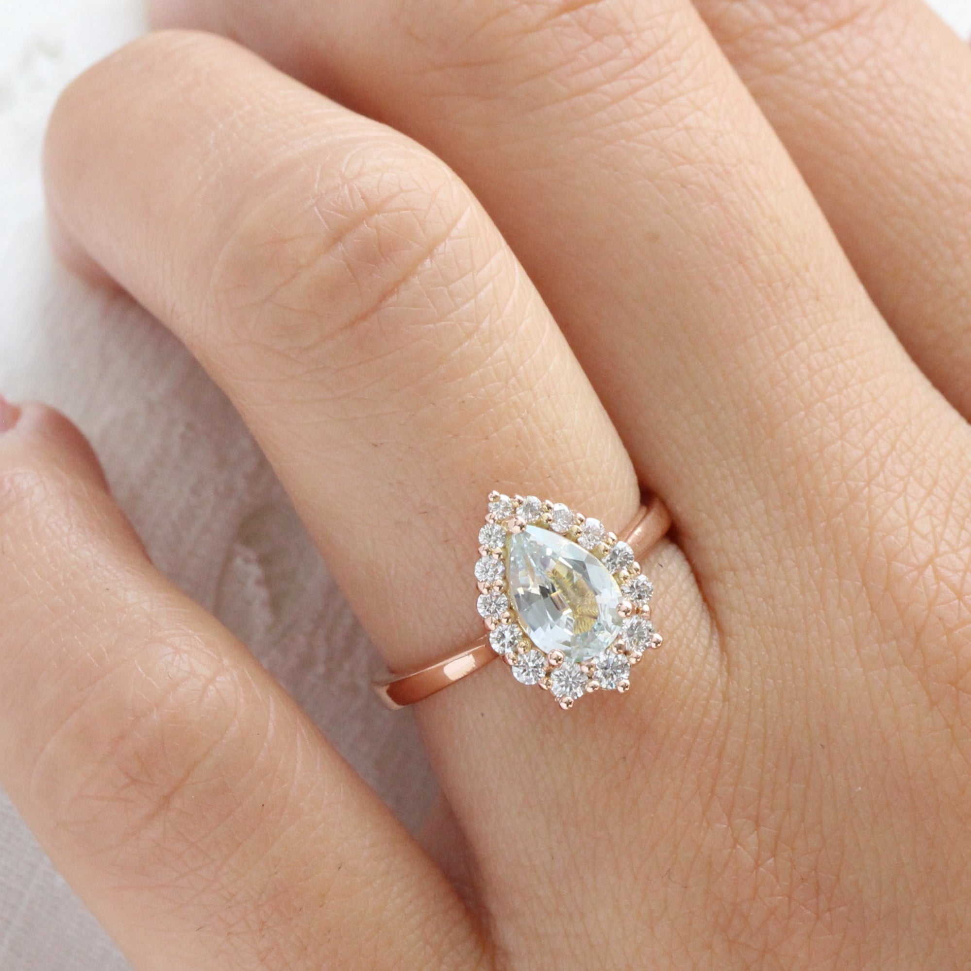 Halo diamond light aqua blue sapphire ring rose gold pear sapphire ring la more design jewelry