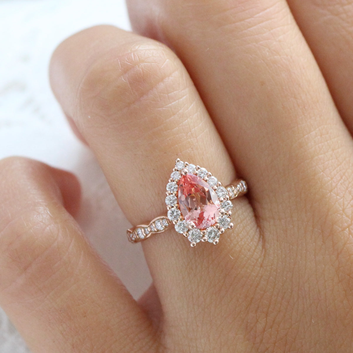 Large pear pink sapphire ring rose gold halo diamond peach sapphire engagement ring la more design jewelry