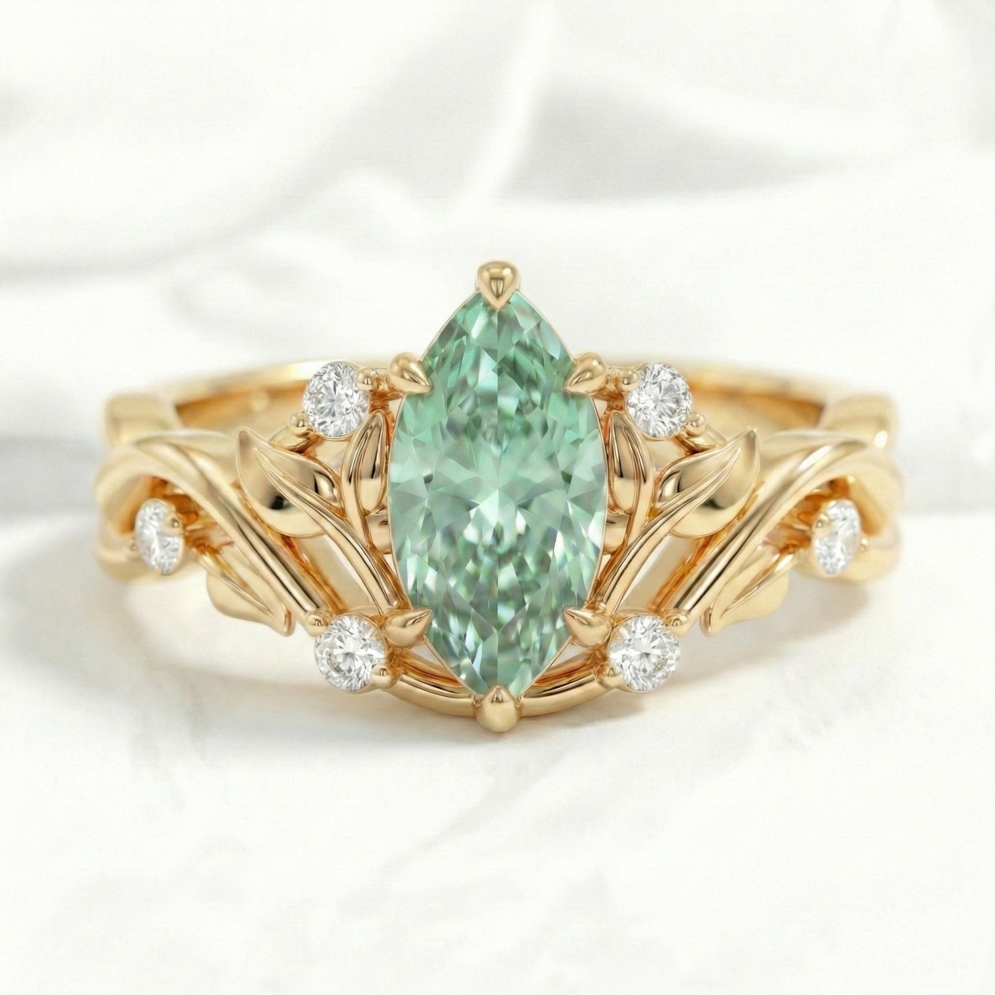 Marquise green sapphire engagement ring yellow gold floral leaf diamond band la more design jewelry