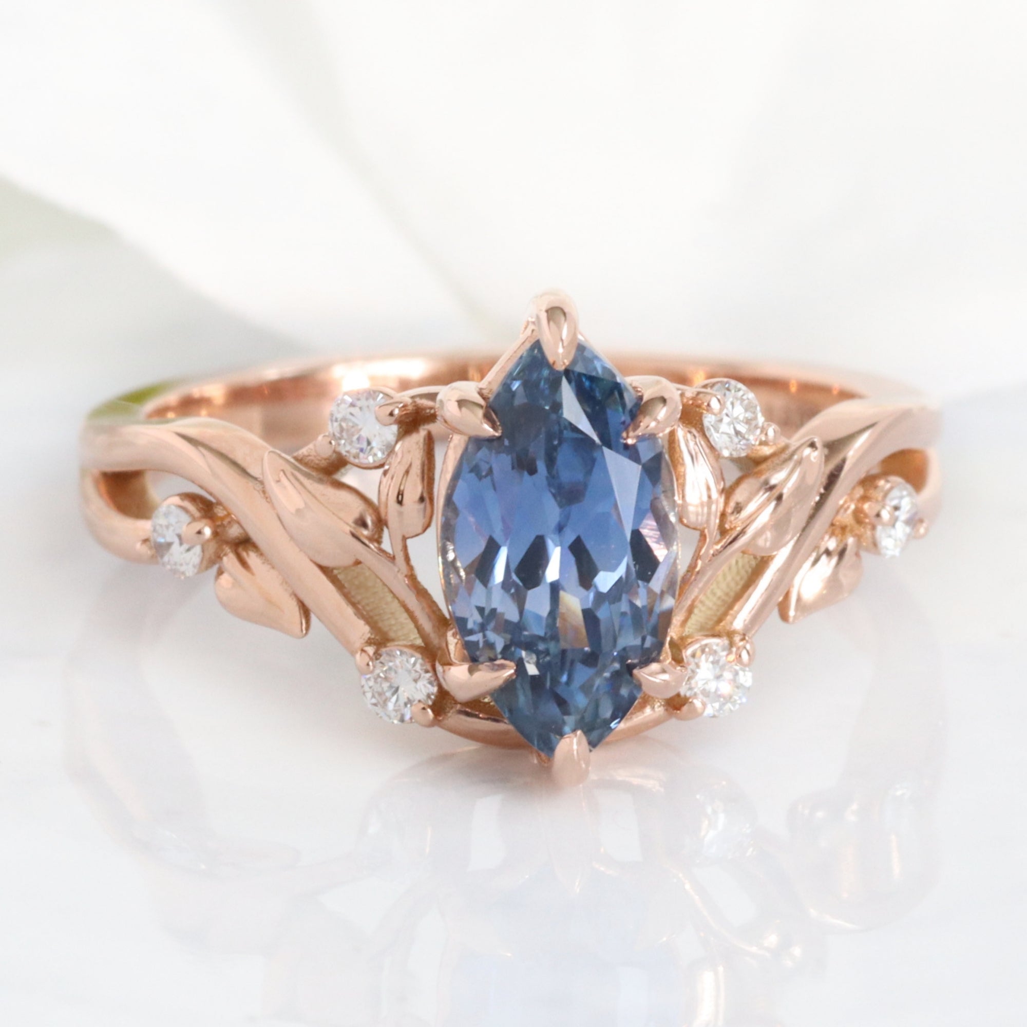 Marquise teal blue sapphire ring rose gold floral leaf diamond sapphire solitaire ring la more design jewelry
