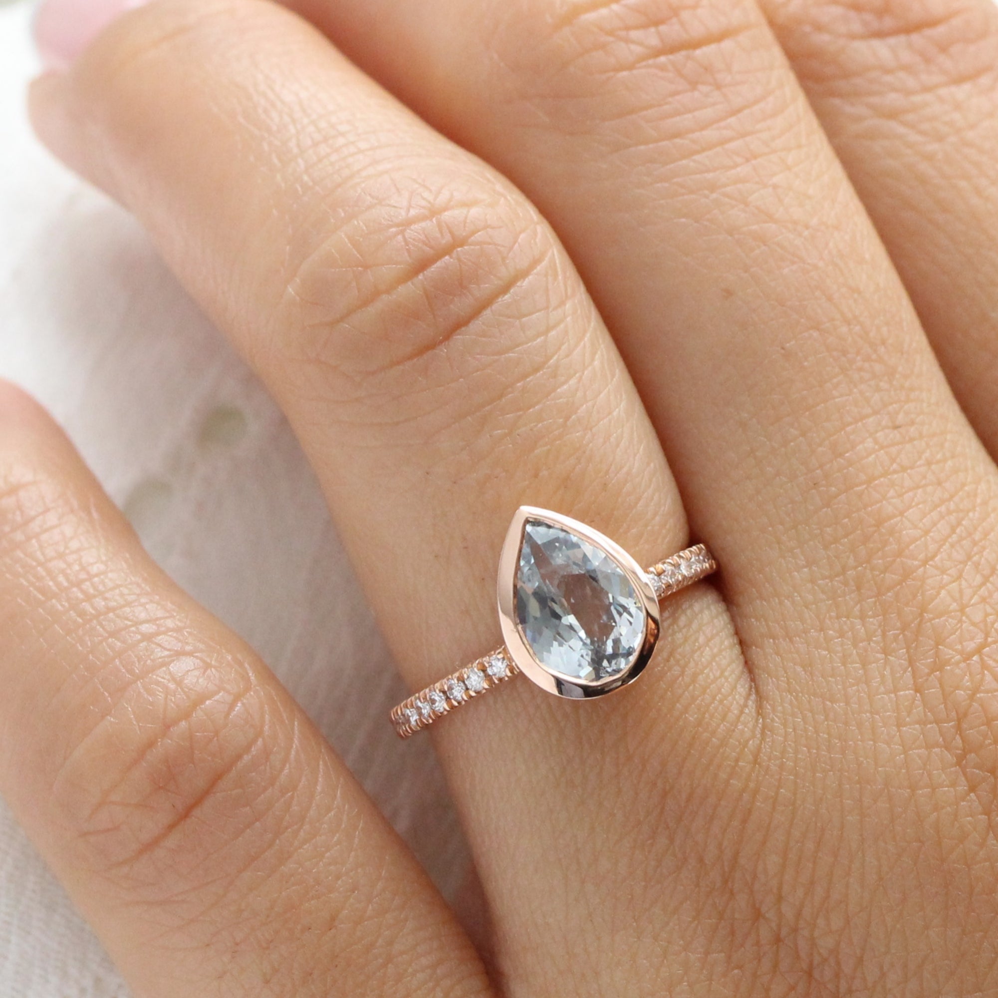 Pear aqua blue sapphire ring rose gold bezel solitaire pave diamond band la more design jewelry