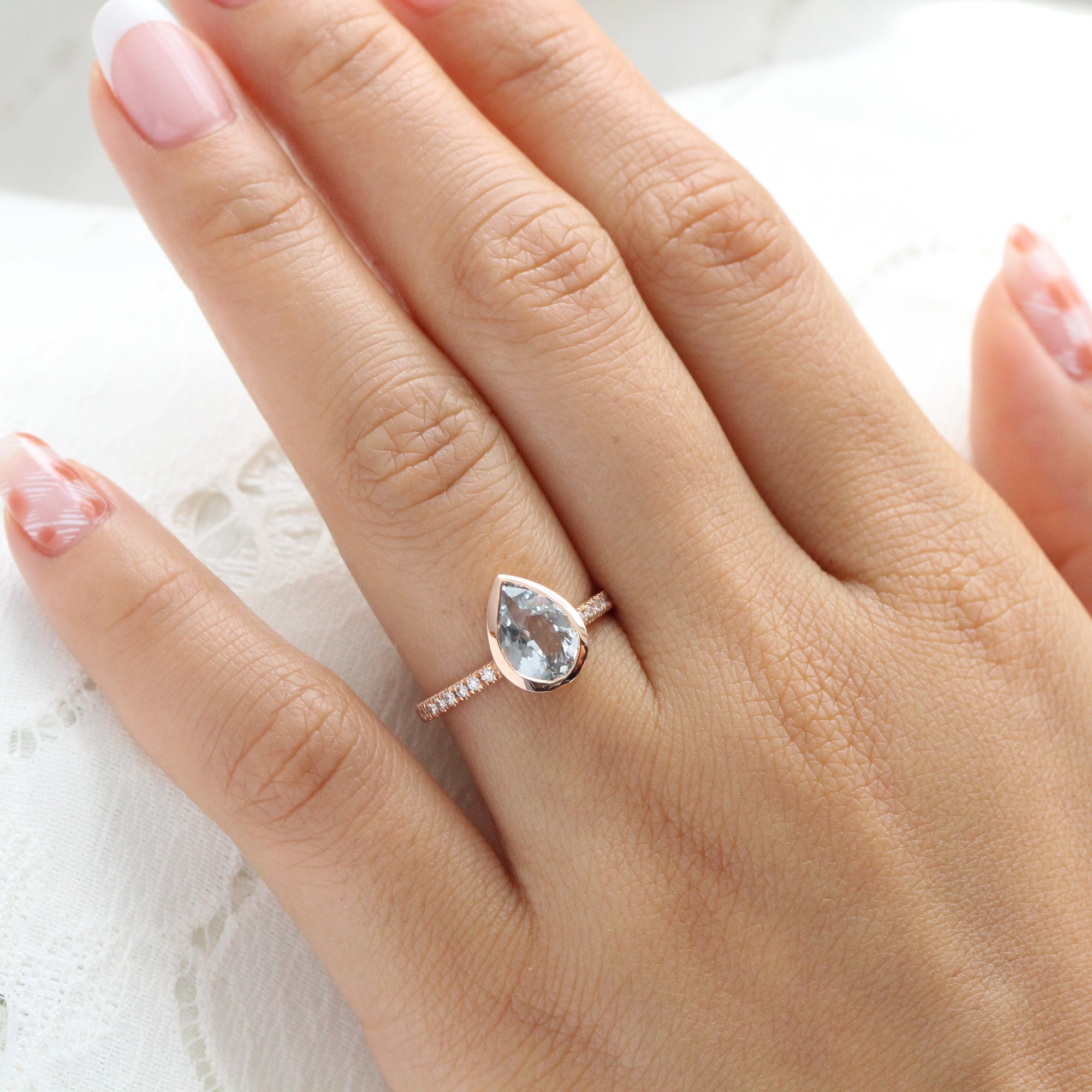 Pear aqua blue sapphire ring rose gold bezel solitaire pave diamond band la more design jewelry