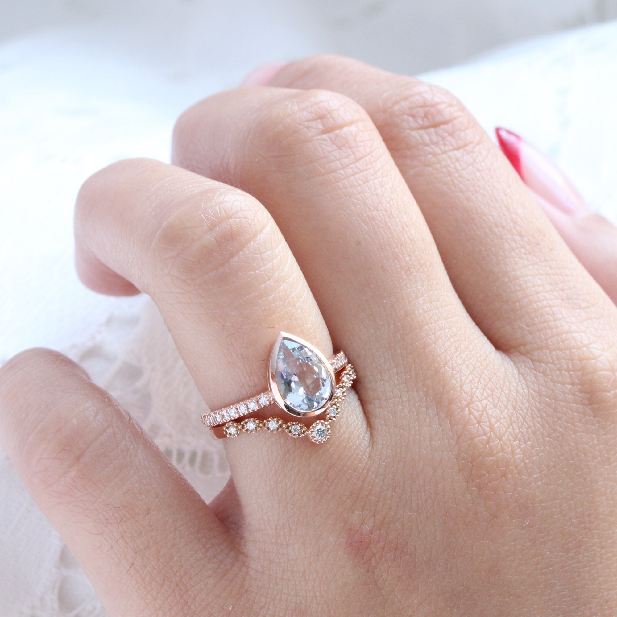 Pear aqua blue sapphire ring rose gold bezel solitaire pave diamond band la more design jewelry