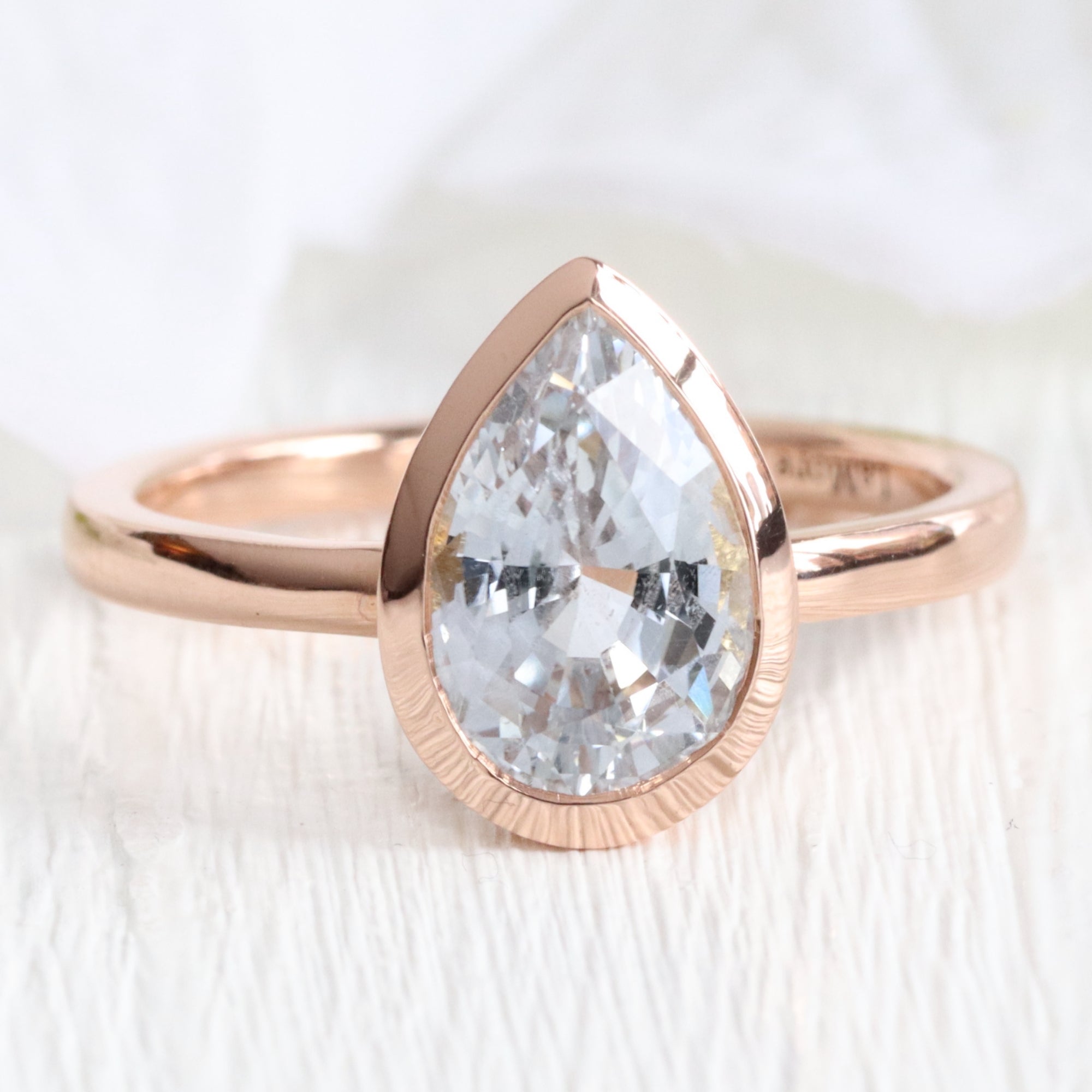 Pear aqua blue sapphire ring rose gold bezel solitaire ring la more design jewelry