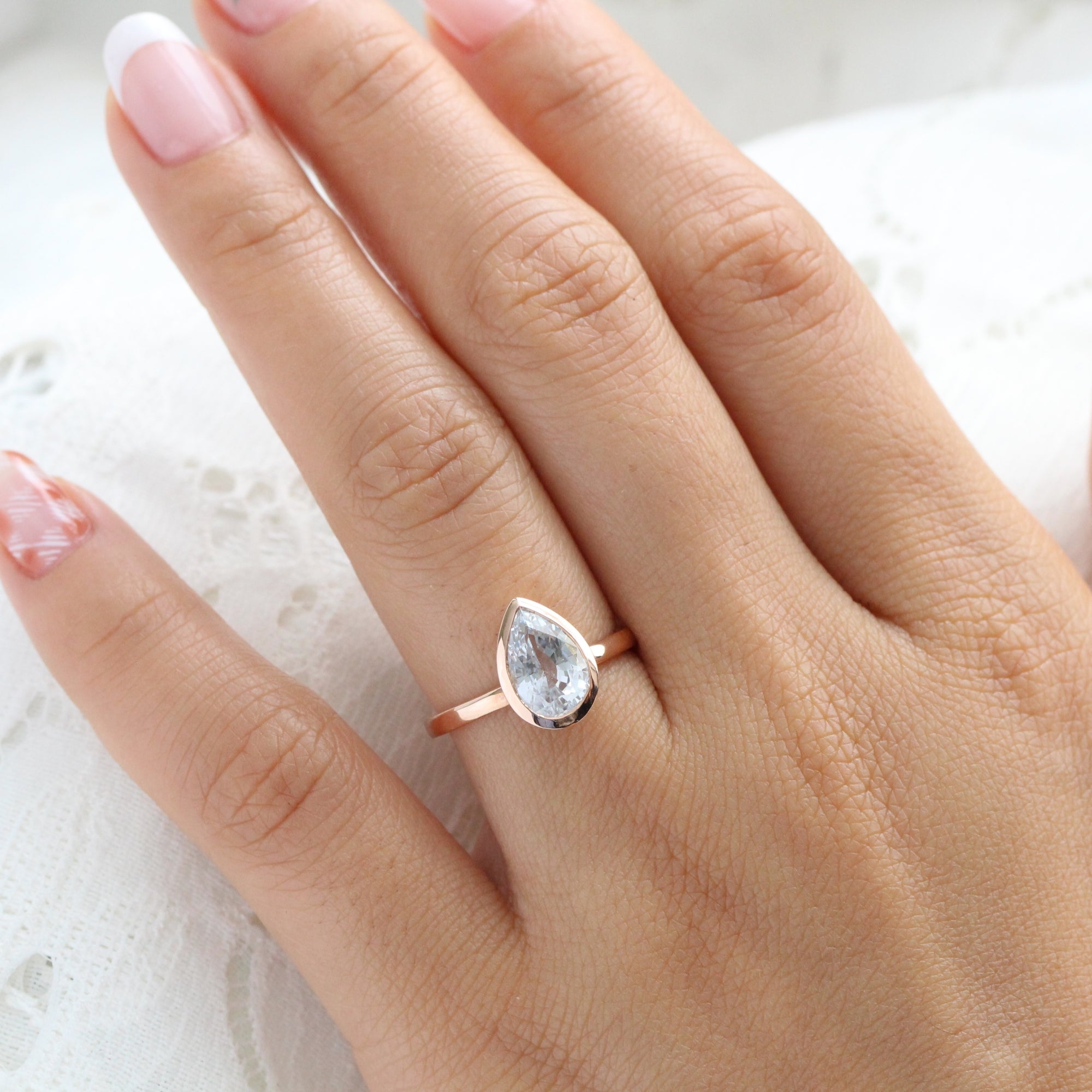 Pear aqua blue sapphire ring rose gold bezel solitaire ring la more design jewelry
