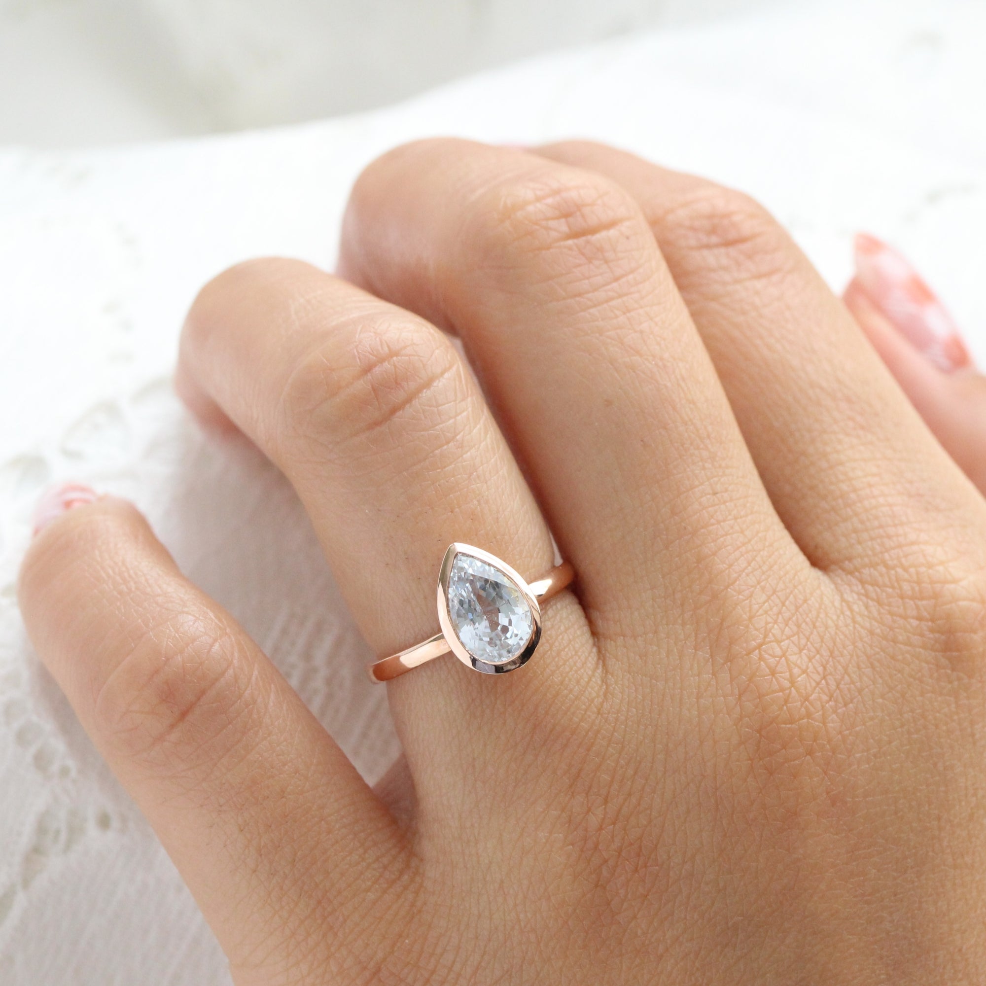 Pear aqua blue sapphire ring rose gold bezel solitaire ring la more design jewelry