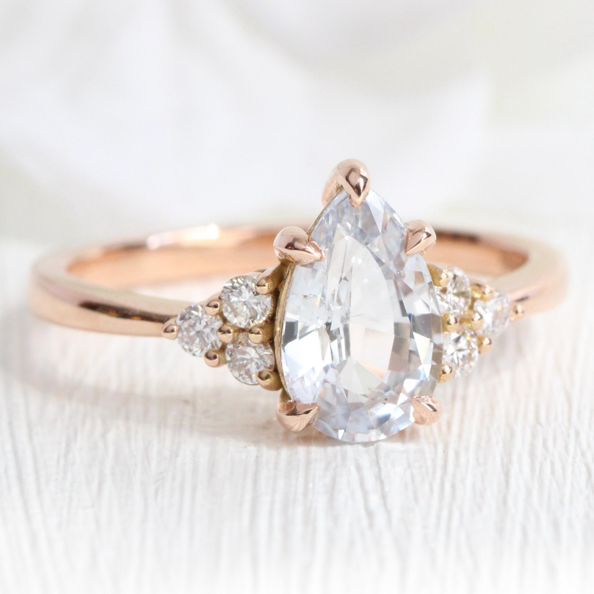 Pear cut white sapphire ring rose gold 3 stone diamond ring la more design jewelry