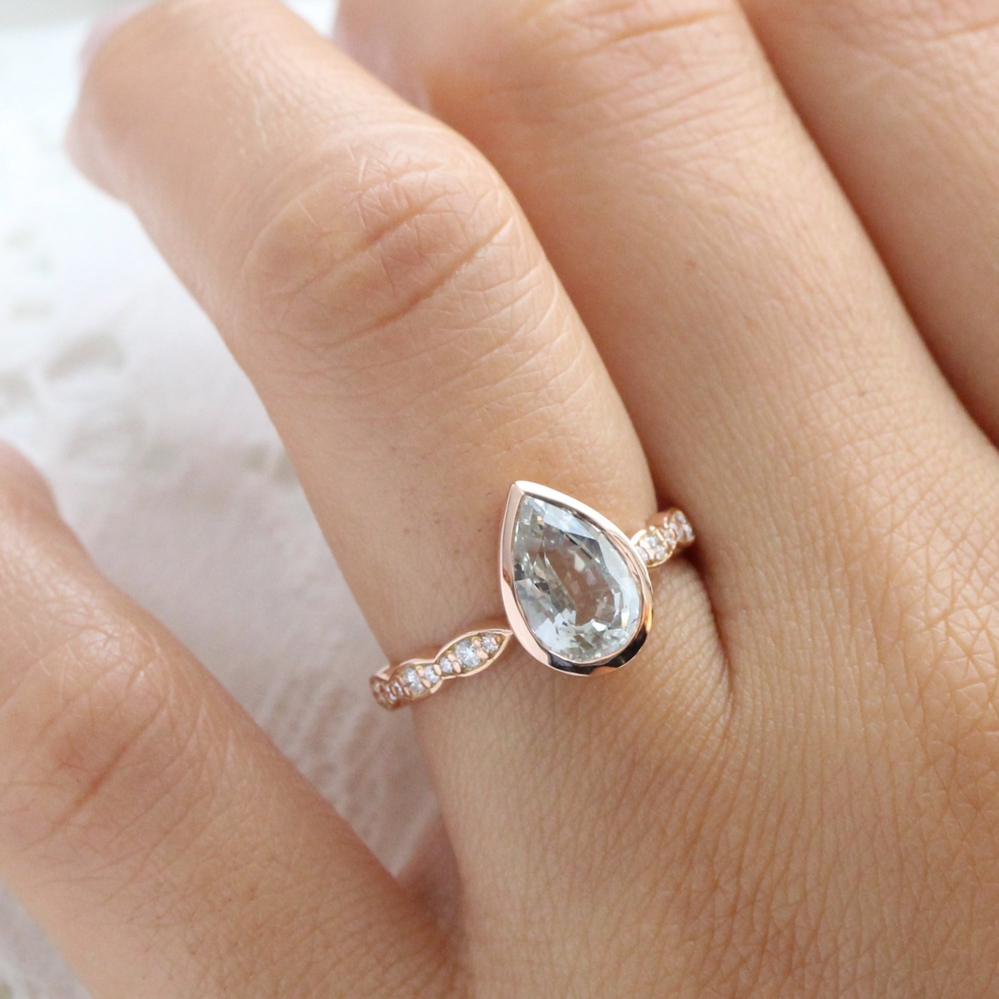 Pear seaform green sapphire ring rose gold bezel solitaire scalloped diamond band la more design jewelry