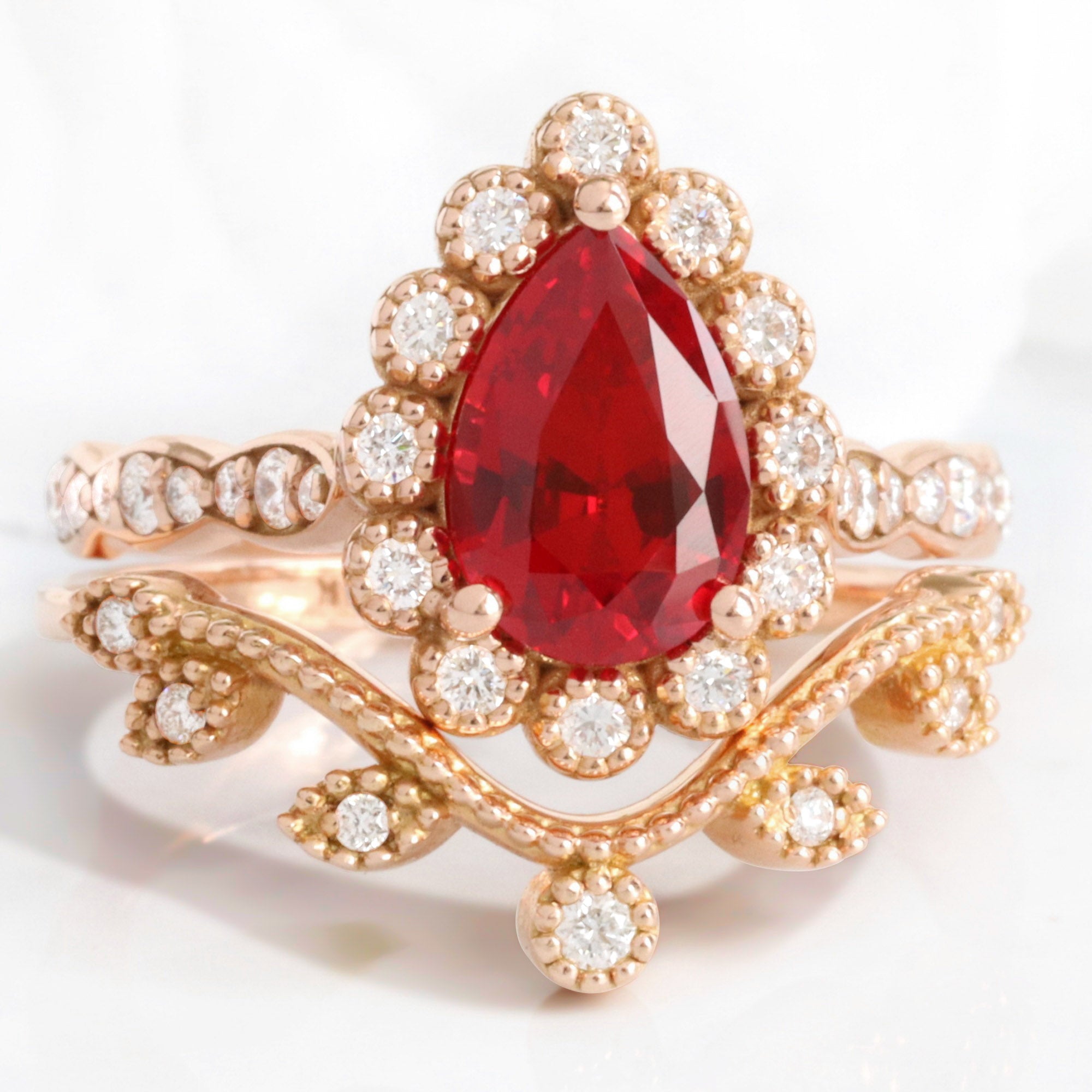 Vintage style pear ruby ring bridal set rose gold curved leaf diamond wedding ring stack la more design jewelry