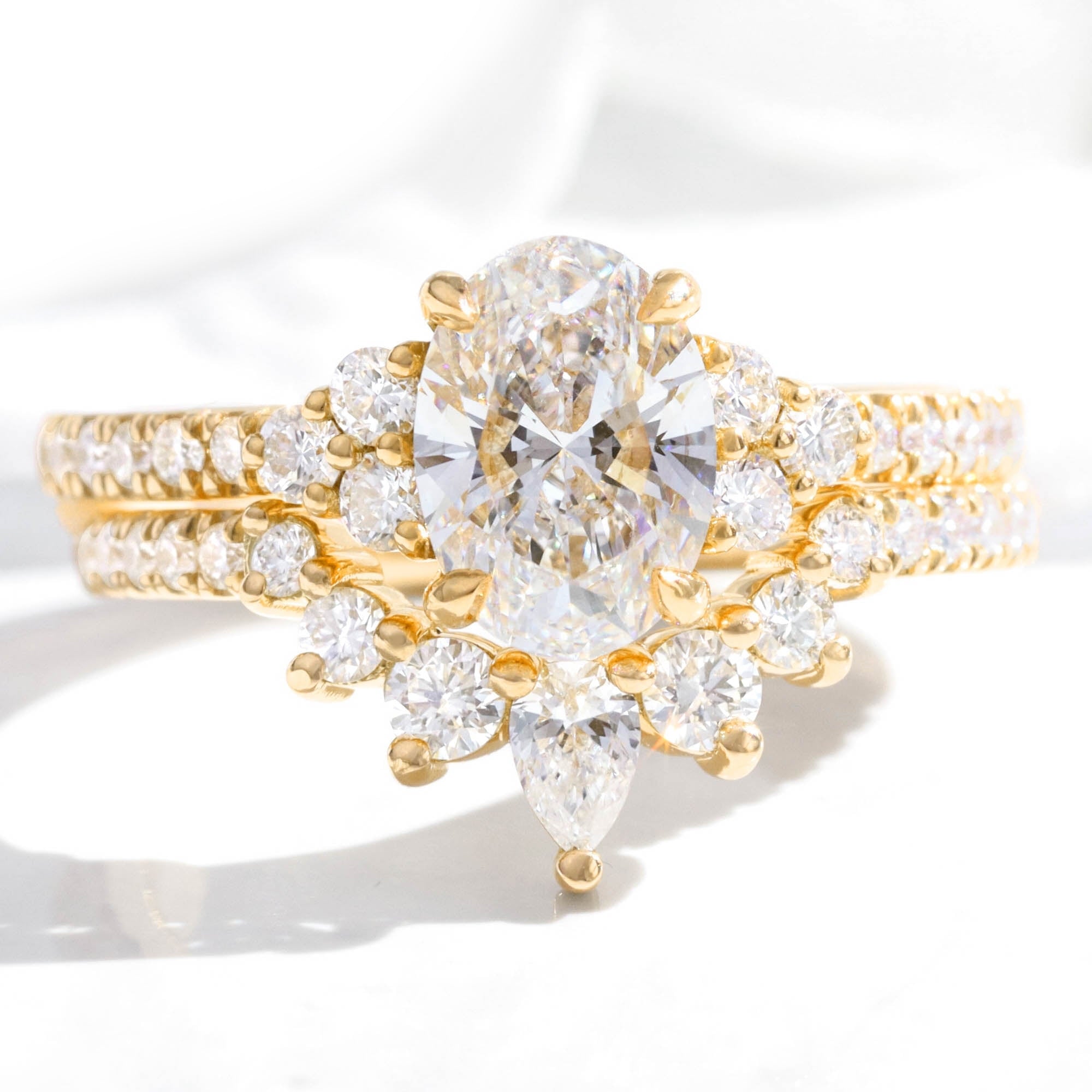 lab grown diamond 3 stone ring bridal set yellow gold U shaped diamond wedding band la more design jewelry