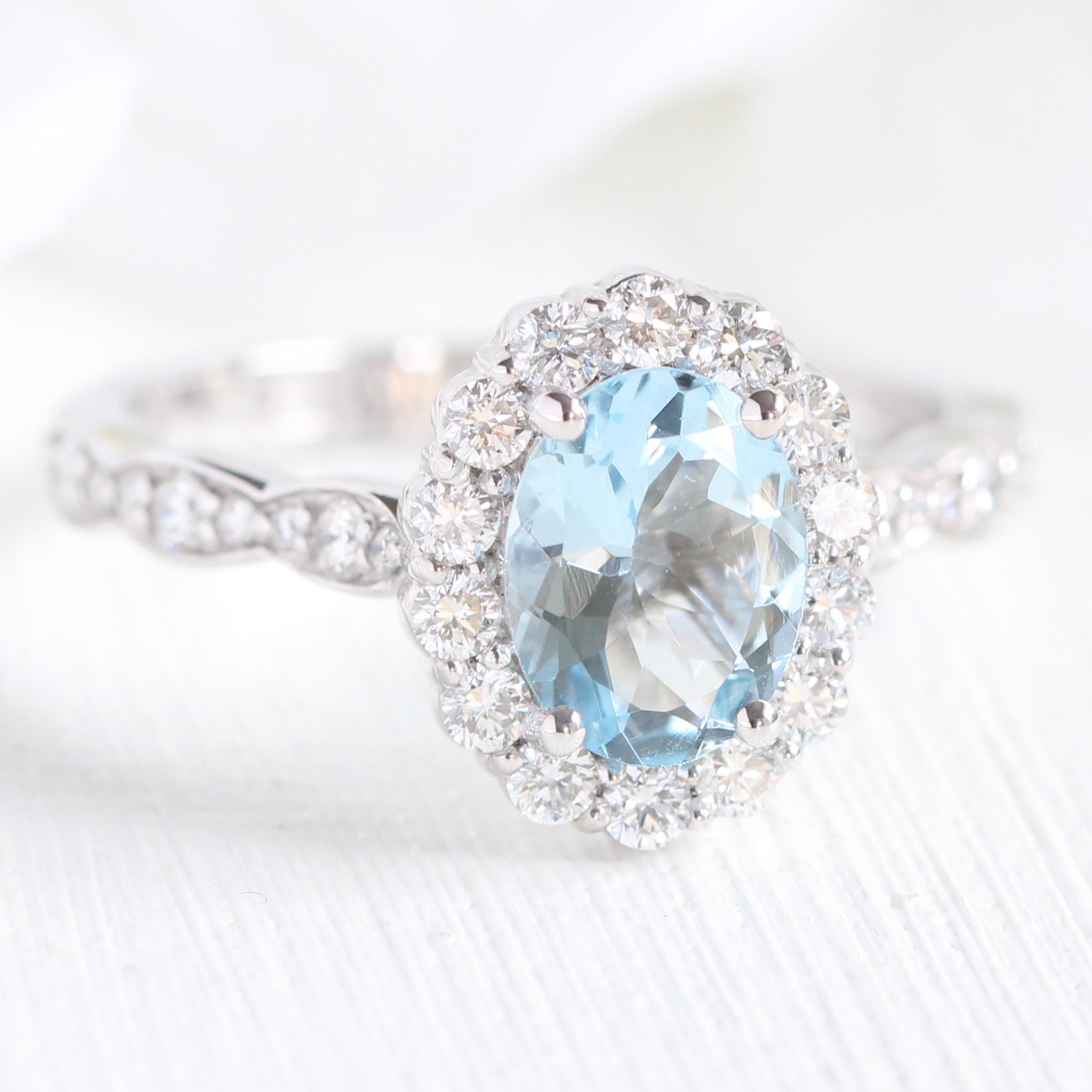 aquamarine-engagement-ring-scalloped-halo-diamond-ring-white-gold-oval-cut-ring-by-la-more-design