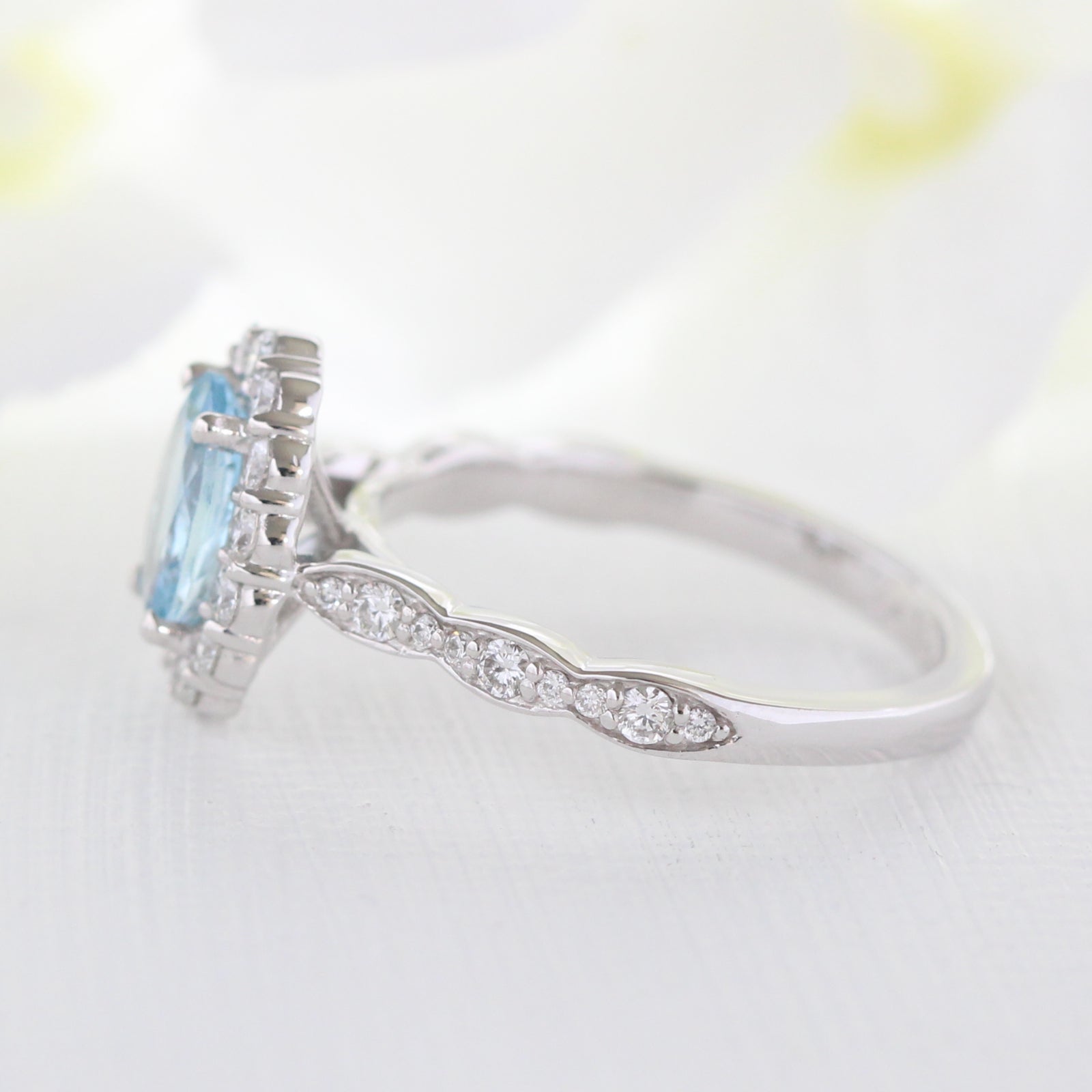 aquamarine-engagement-ring-scalloped-halo-diamond-ring-white-gold-oval-cut-ring-by-la-more-design
