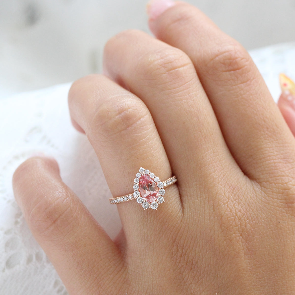 pear shaped peach sapphire engagement ring rose gold halo diamond pink sapphire ring la more design jewelry