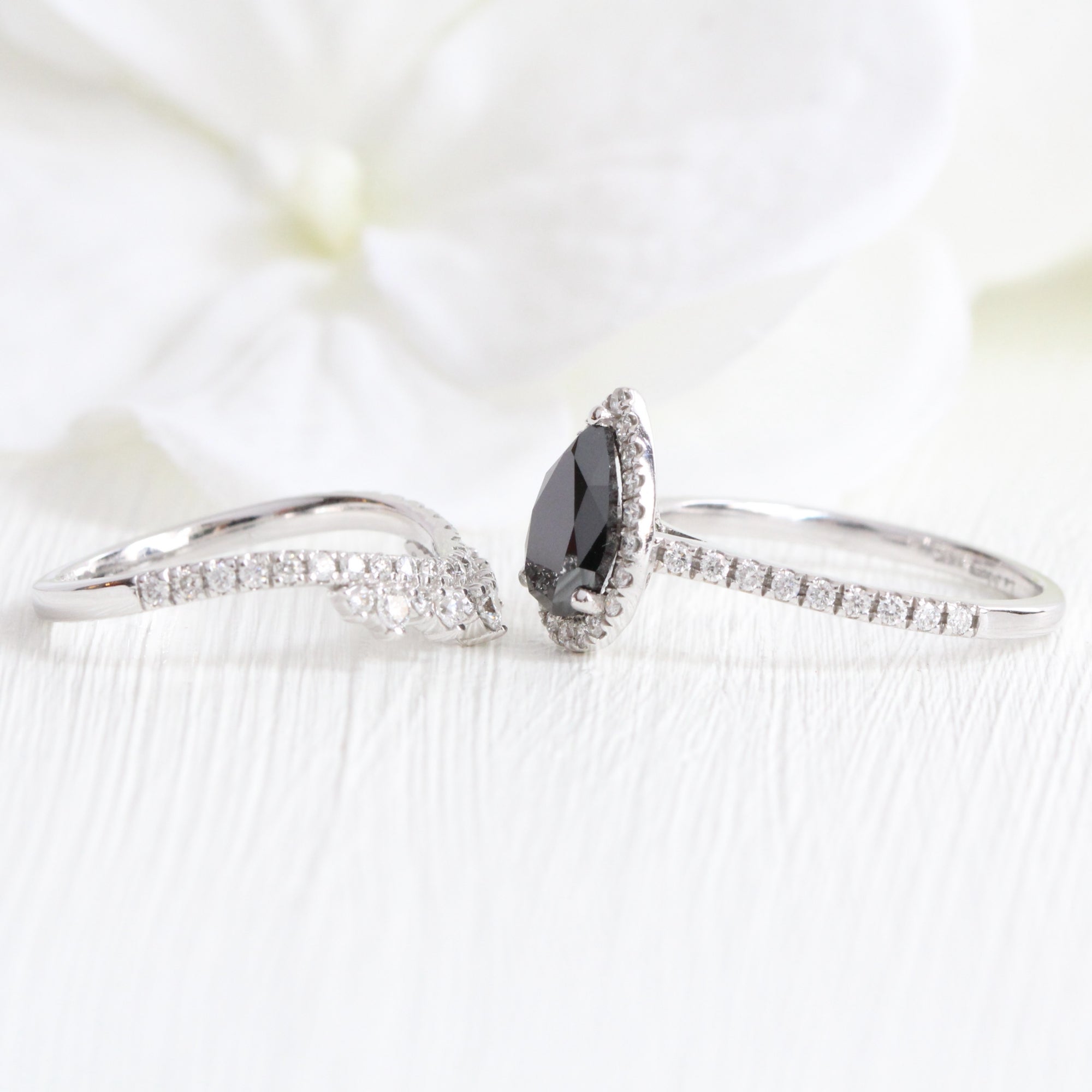 pear black diamond engagement ring and crown diamond wedding band in white gold halo ring bridal set by la more design jewelry