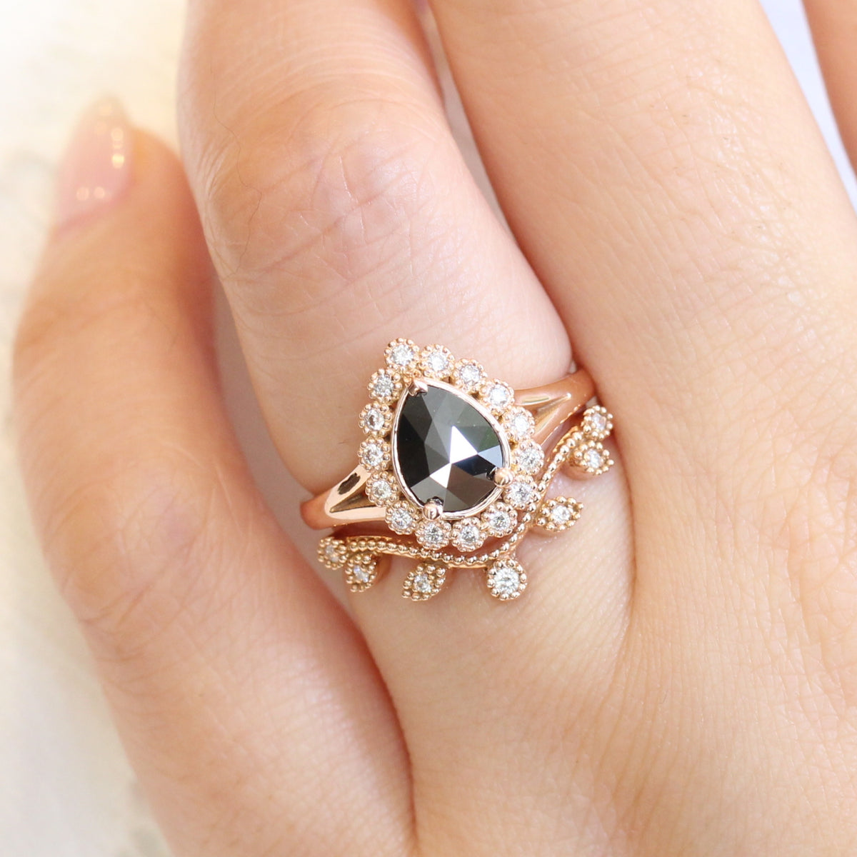 pear rose cut black diamond ring rose gold and curved leaf diamond wedding ring set by la more design jewelry