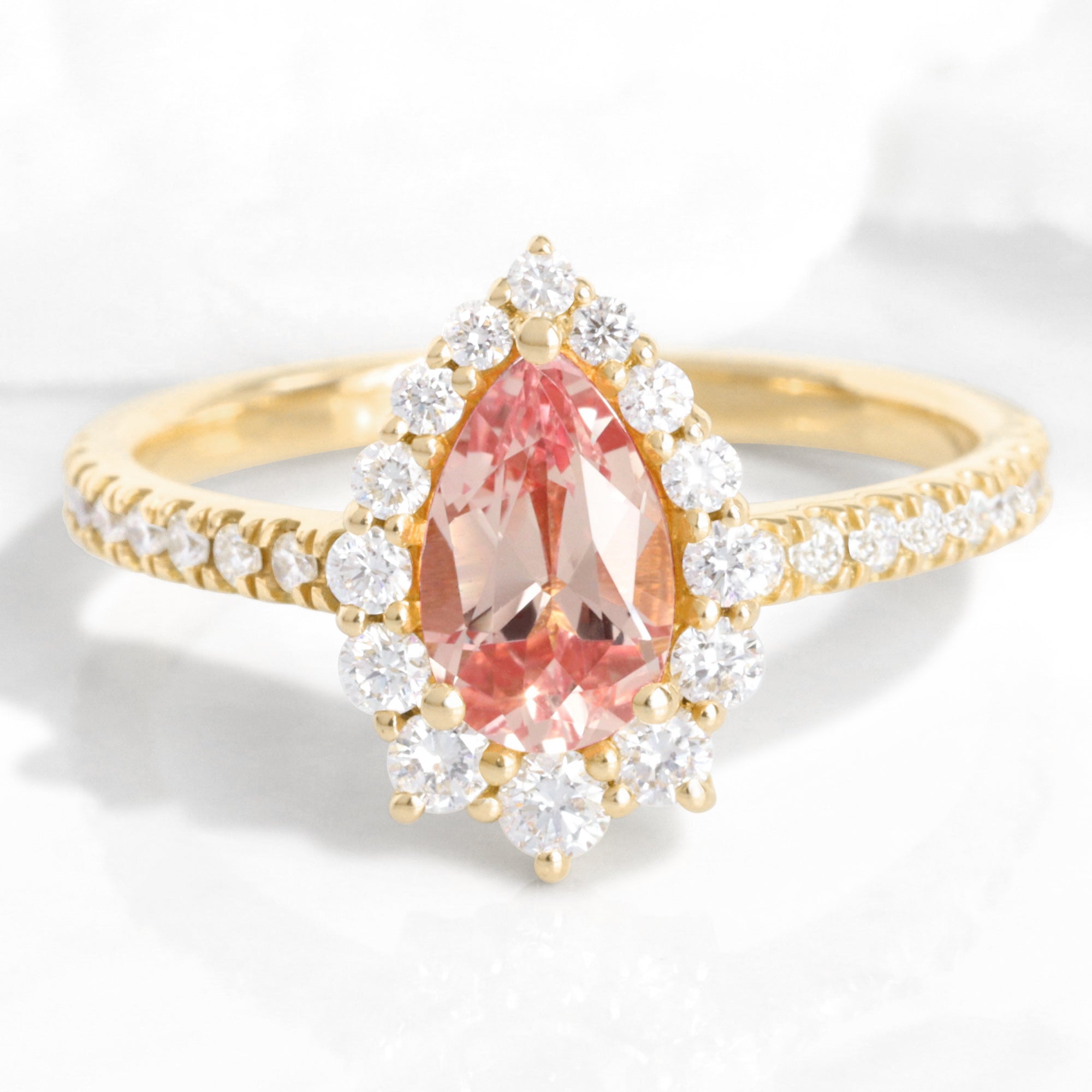 pear shaped peach sapphire engagement ring yellow gold halo diamond pink sapphire ring la more design jewelry