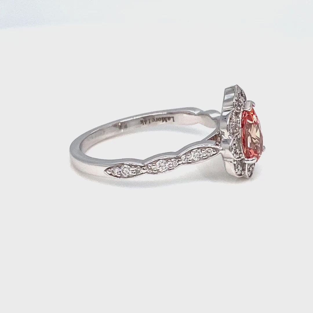 vintage inspired peach sapphire pear engagement ring in white gold curved diamond band by la more design jewelry