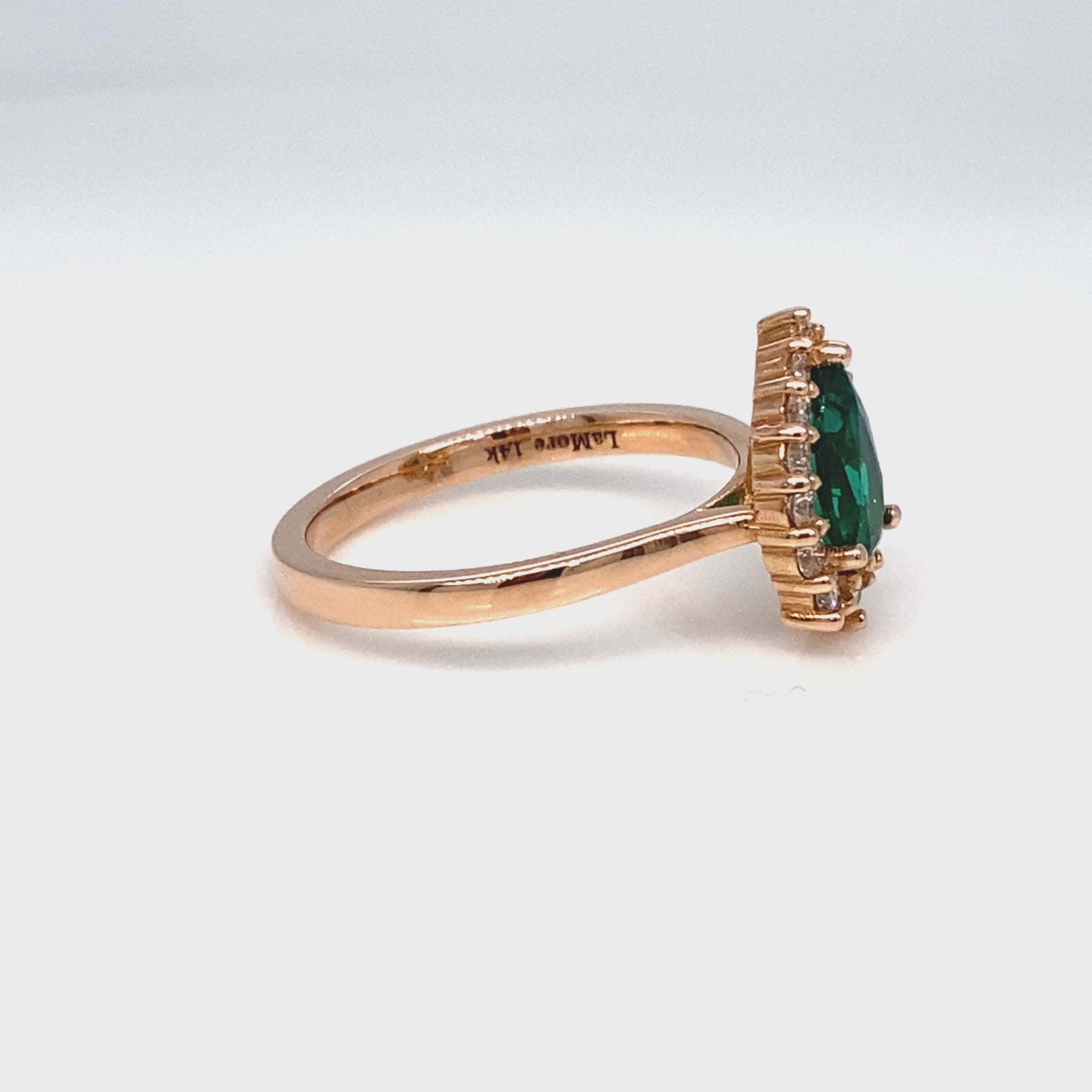 Pear Emerald Engagement Ring in Tiara Halo Diamond Tapered Band