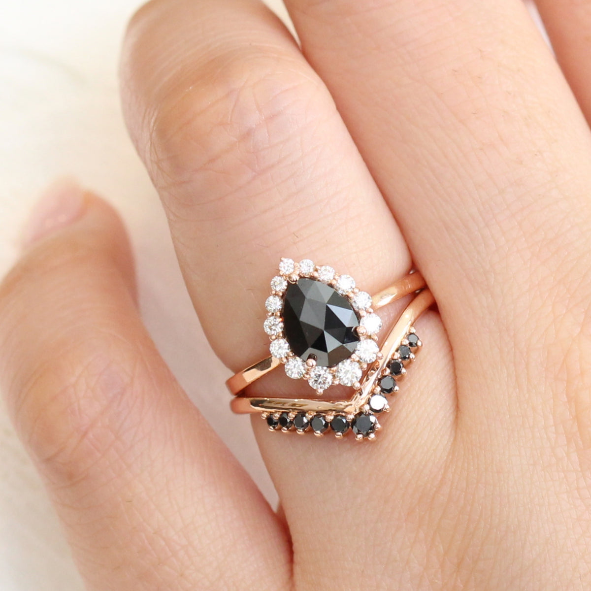 rose gold pear rose cut black diamond ring and v shaped diamond wedding ring set by la more design jewelry