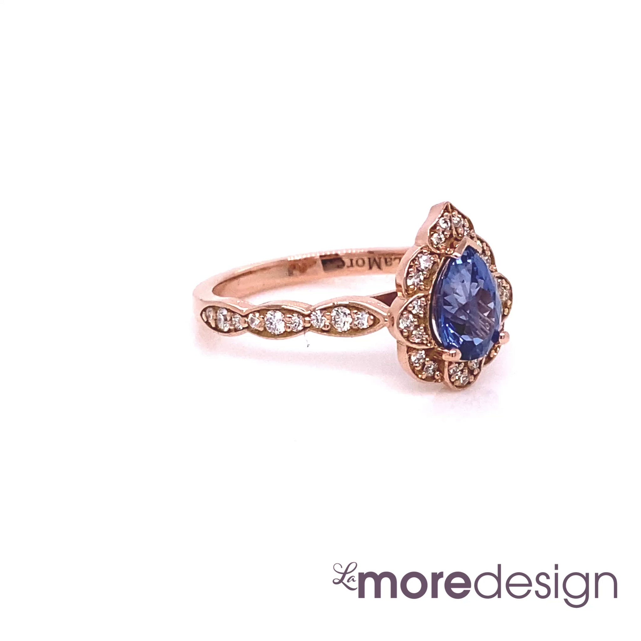 This breathtakingly gorgeous sapphire engagement ring is crafted in 14k rose gold vintage floral diamond ring setting with a 1.25-carat pear cut natural blue sapphire center ~ total gemstone and diamond weight of the whole ring is 1.57 ct.tw. This unique yet elegant vintage-inspired pear-cut engagement ring will guarantee a big smile on your future bride's face! All our wedding bands can pair beautifully with this gorgeous vintage floral diamond sapphire ring!