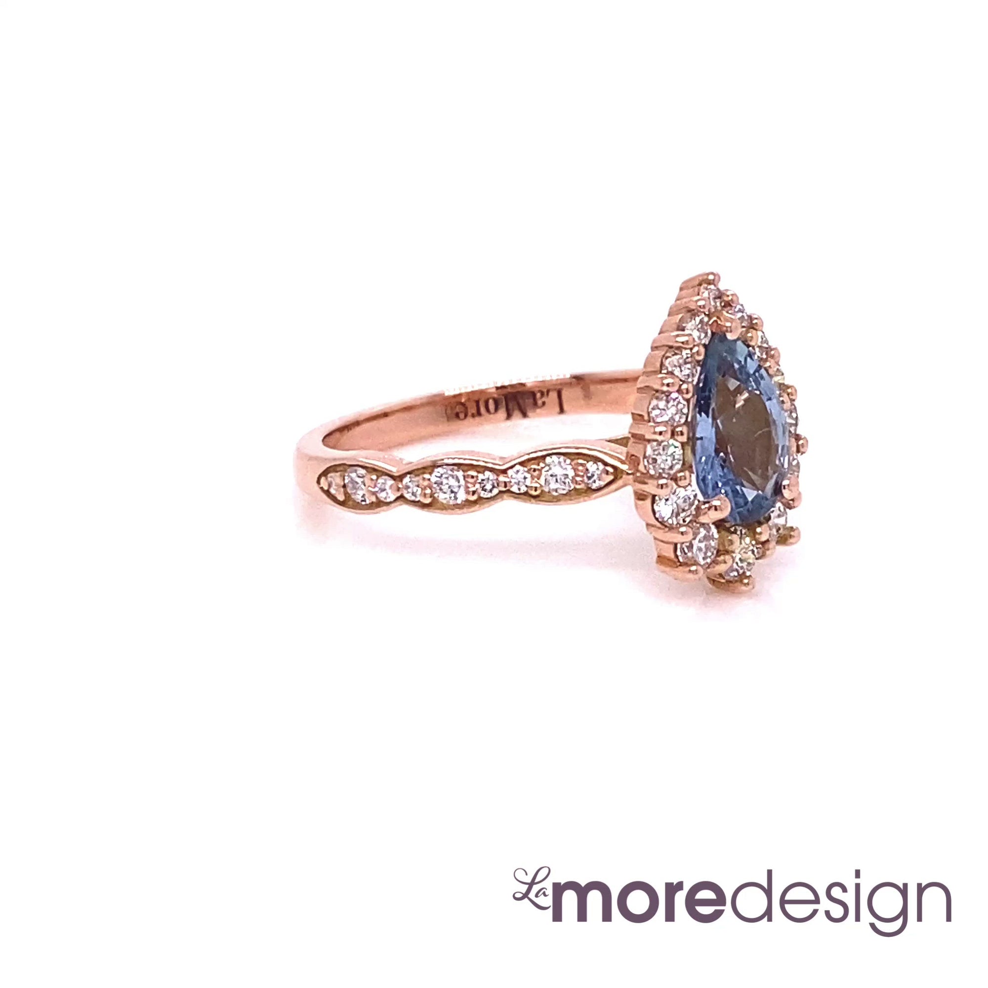 This timelessly gorgeous yet unique blue sapphire engagement ring is crafted in 14k rose gold Tiara Halo Diamond ring setting with a 0.90-carat pear cut natural aqua blue sapphire center ~ the total gemstone and diamond weight of the whole ring is 1.48 ct.tw.  This one-of-a-kind sapphire ring is perfect for brides looking for non-traditional engagement rings. All our wedding bands can pair beautifully with this gorgeous tiara halo diamond blue sapphire ring!