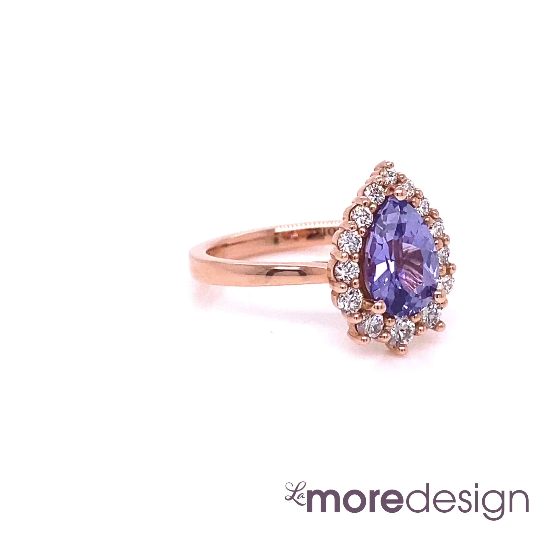 Simply stunning and elegant lavender sapphire engagement ring is crafted in 14k rose gold Tiara Halo Diamond ring setting with a 1.45-carat pear cut natural lavender purple sapphire center ~ total gemstone and diamond weight of the whole ring is 1.83 ct.tw.  This one-of-a-kind sapphire diamond ring is perfect for brides looking for diamond alternative engagement rings! All our wedding bands can pair beautifully with this gorgeous halo diamond sapphire ring!
