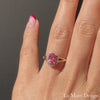 oval peach sapphire engagement ring in rose gold halo diamond band by la more design