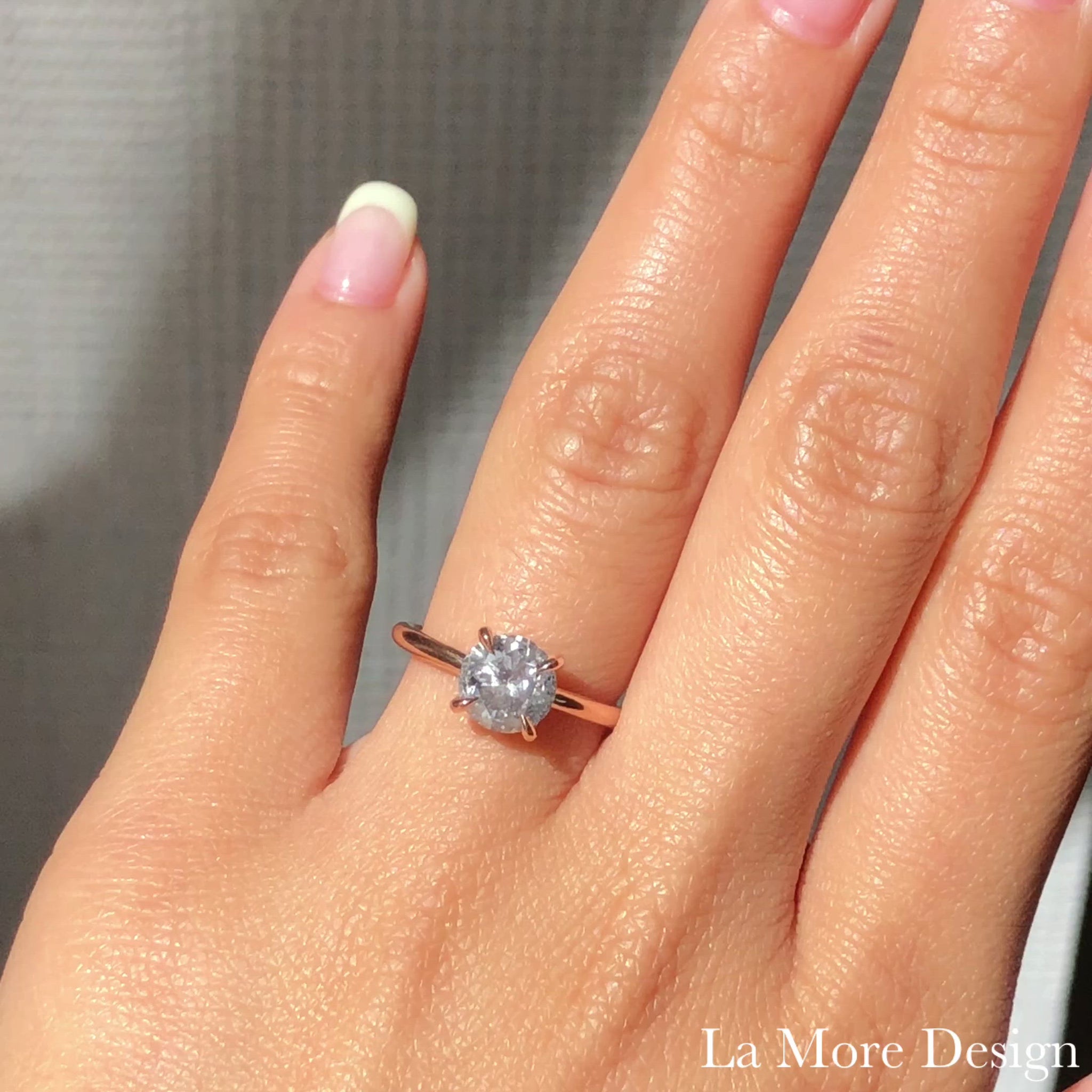This stunningly gorgeous grey diamond engagement ring features a large 1.81 carat round cut natural salt and pepper diamond set in a 14k rose gold flat set low profile solitaire ring setting that lays flat perfectly on top of your finger for comfortable wear. Adore your love with this large diamond ring today!