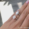 Halo diamond pear moissanite engagement ring in rose gold scalloped band by la more design jewelry