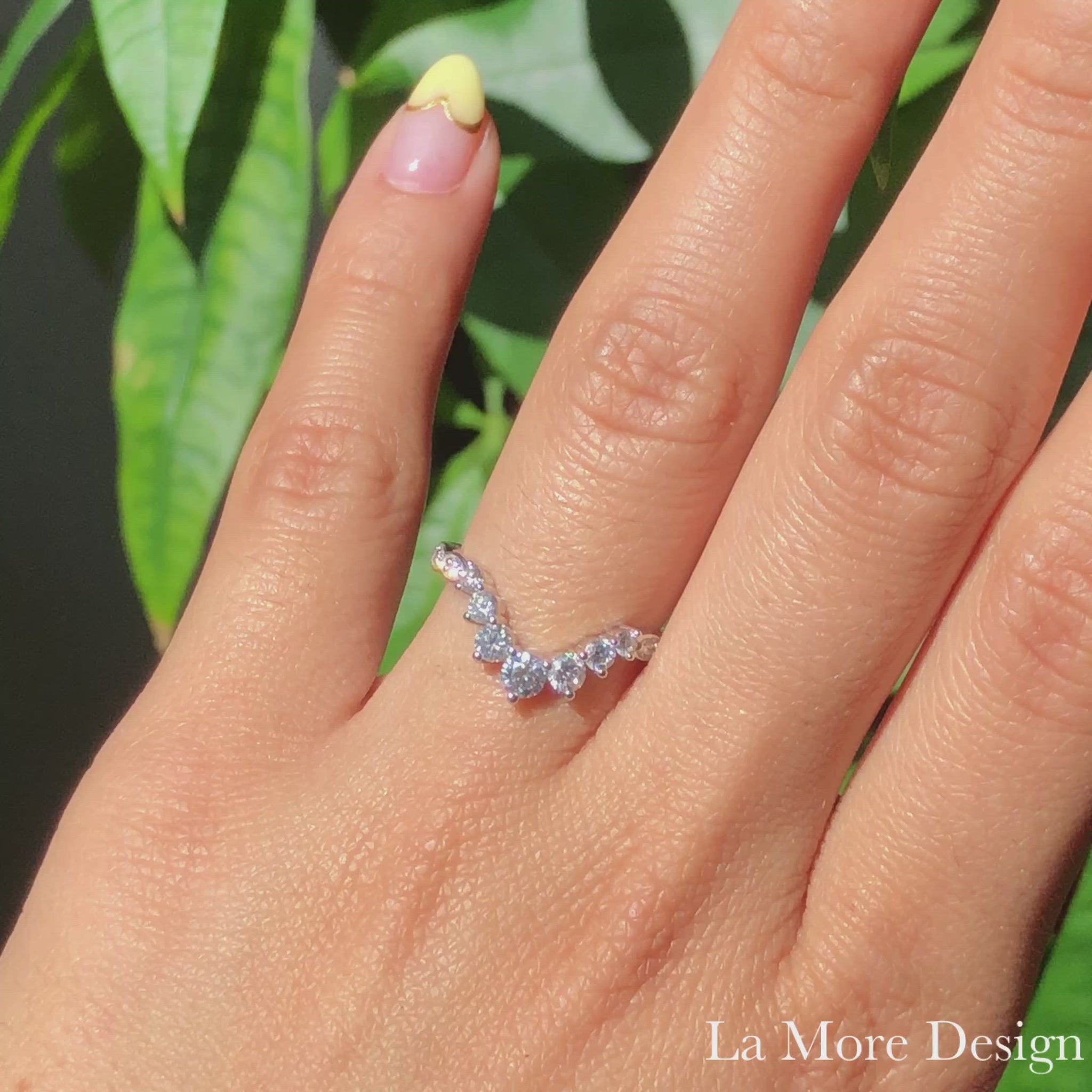 Stunningly unique large diamond band sparkles from every angle! This curved diamond wedding ring features large seven round brilliant cut diamonds set gracefully in 14k white gold. To add a breathtaking effect to this contour wedding band, the curved diamond band is finished in a scalloped band. 