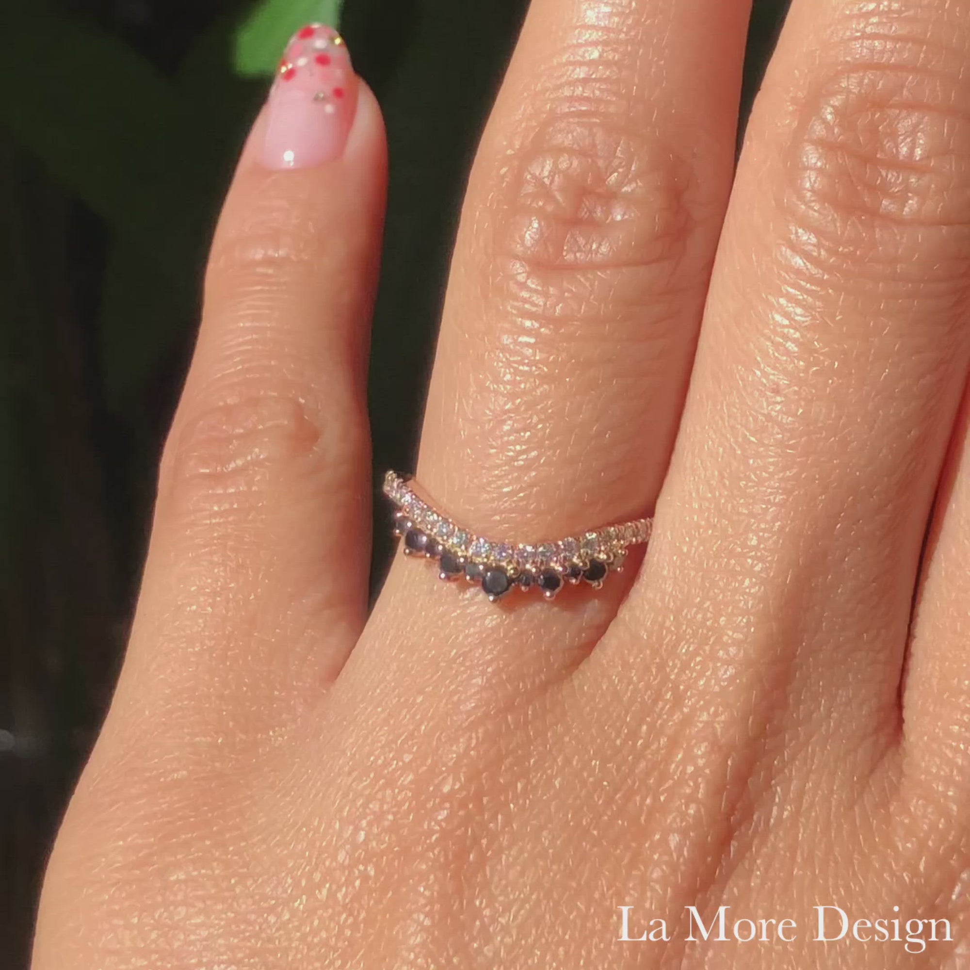 This unique crown wedding band features white diamonds set in a rose gold pave band and to add a stunning effect to this curved ring, brilliant black diamonds are set gracefully into the crown. This curved diamond band can be made in your choice of platinum, 18k or 14k white, rose, or yellow gold.