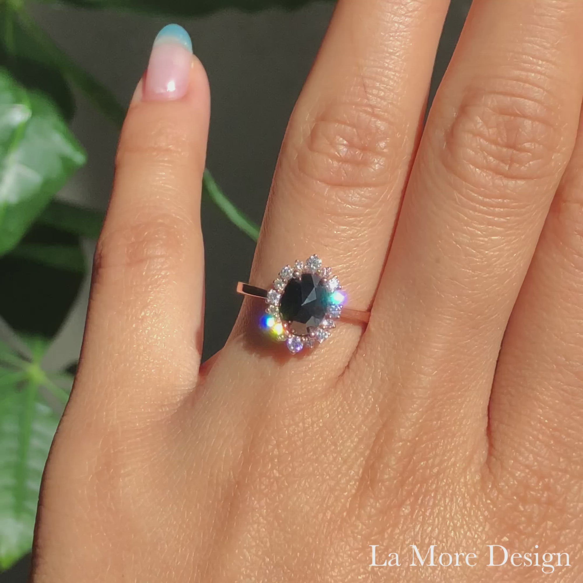 Stunningly gorgeous rose cut black diamond engagement ring in tapered shank is crafted in 14k rose gold tiara halo diamond ring setting featuring an 8x6mm oval shaped rose cut black diamond. The petite band gently tapers toward the center diamond, creating a gorgeous feminine curve. This rose cut diamond tapered engagement ring is perfect for brides looking for a delicate yet unique diamond ring. 